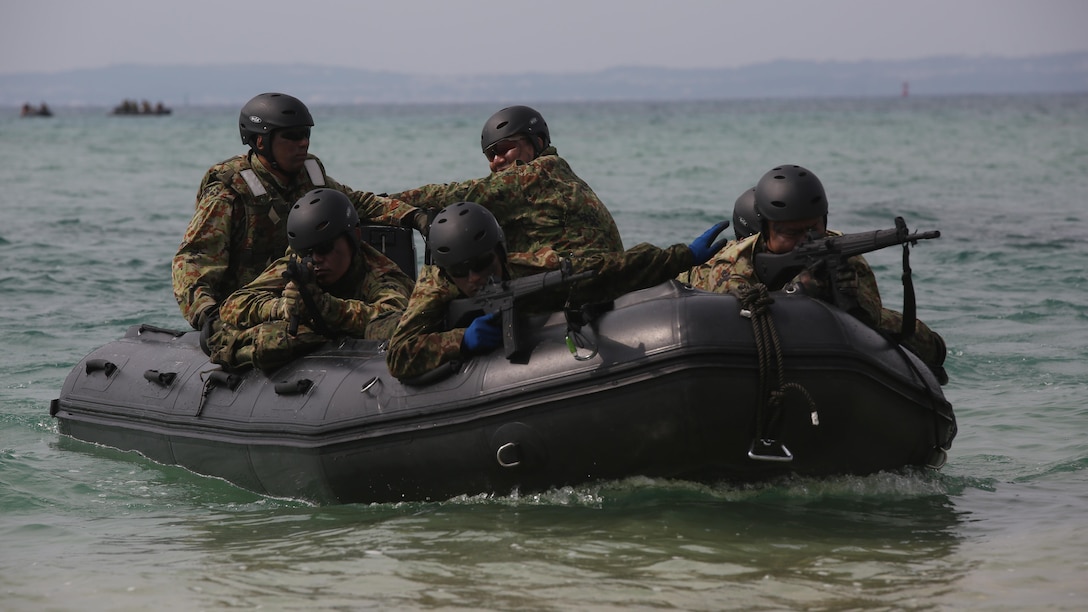 Japanese Ground Self-Defense Force soldiers sight in on their rifles while riding on a Combat Rubber Raiding Craft during the Japanese Observer Exchange Program April 27, 2015 at Kin Blue. JOEP is a III Marine Expeditionary Force, 31st Marine Expeditionary Unit and JGSDF coordinated program designed to increase regional security, maintain unit readiness and enhance overall cooperation. This is the fourth iteration of JOEP for the 31st MEU after the initial partnership in September 2012.  (U.S. Marine Corps photo by Cpl. Ryan C. Mains/Released)