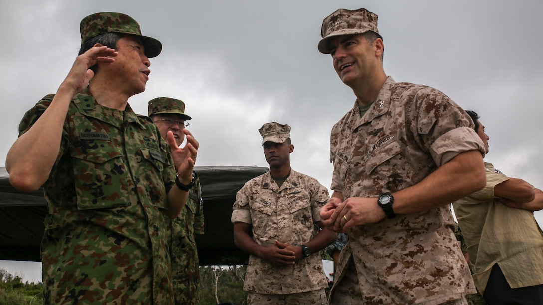 Col. Romin Dasmalchi speaks with Japanese Ground Self-Defense Force soldiers during the Japanese Observer Exchange Program April 28, 2015 at Kin Blue. JOEP is a III Marine Expeditionary Force, 31st Marine Expeditionary Unit and JGSDF coordinated program designed to increase regional security, maintain unit readiness and enhance overall cooperation. This is the fourth iteration of JOEP for the 31st MEU after the initial partnership in September 2012. Dasmalchi is the commanding officer for the 31st Marine Expeditionary Unit. (U.S. Marine Corps photo by Cpl. Ryan C. Mains/Released)