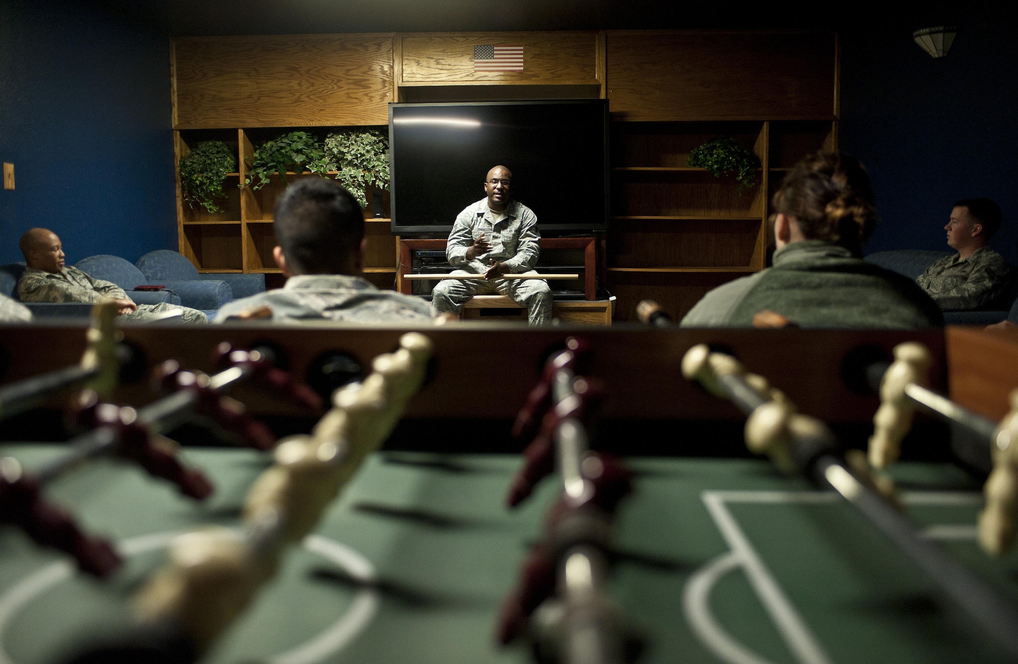 Staff Sgt. Council Jones, the 99th Civil Engineer Squadron airman dormitory leader, talks to a group of Airmen at Nellis Air Force Base, Nev., April 7, 2015. Jones credits his mentors with his success in the Air Force, and now passes on what he can to younger Airmen. (U.S. Air Force photo/Staff Sgt. Siuta B. Ika)
