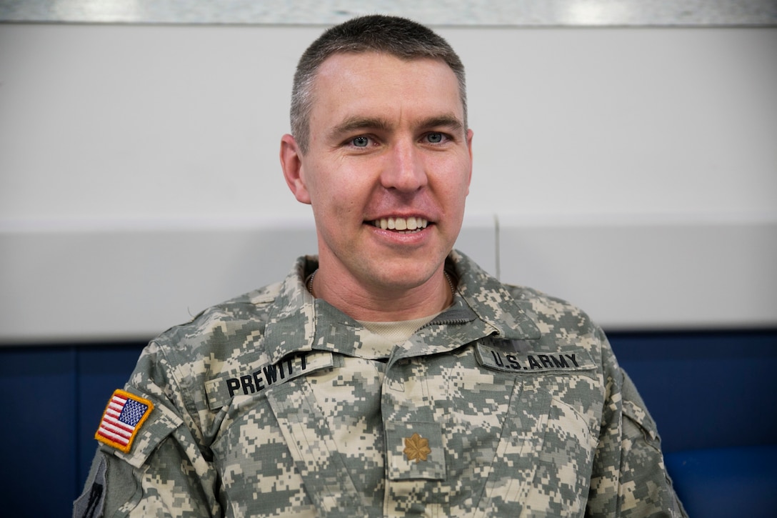 U.S. Army Maj. Andrew K. Prewitt, from Boston, Massachusetts, waits for a flight to Kathmandu, Nepal, May 6 on Kadena Air Base, Okinawa. U.S. Marines, sailors, soldiers and airmen flew to Nepal May 6 to begin an international joint-service humanitarian-aid mission after a 7.8 magnitude earthquake hit Nepal on April 25. Prewitt is a civil affairs planner with the 351st Civil Affairs Command.