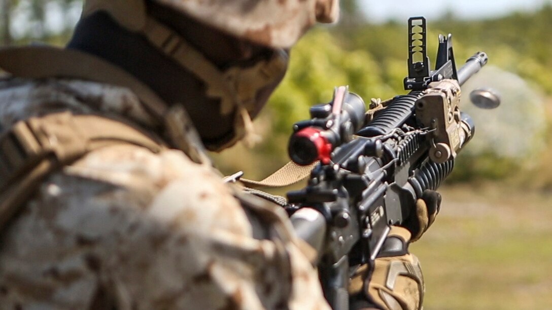 Pfc. Jquan Richardson, a rifleman with 1st Battalion, 8th Marine Regiment, fires his M203 rifle-mounted grenade launcher during a M203 qualification aboard Marine Corps Camp Lejeune, North Carolina, April 5, 2015.  The M203 grenade launcher attaches to a rifle and is able to fire one round at a time.