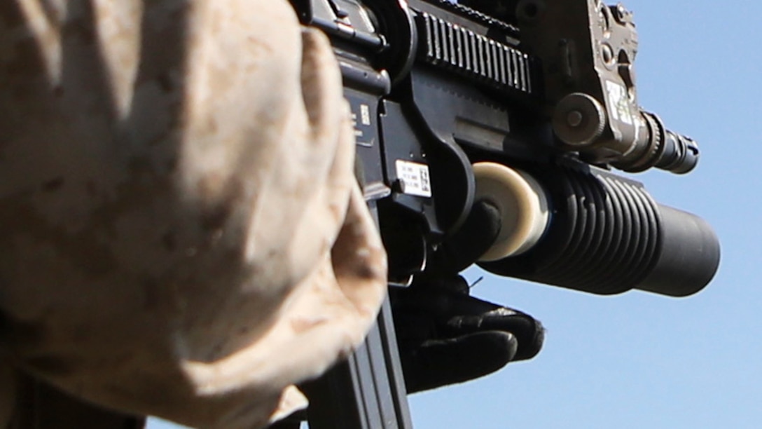 A Marine with 1st Battalion, 8th Marine Regiment, reloads his M203 rifle-mounted grenade launcher during a M203 qualification aboard Marine Corps Base Camp Lejeune, North Carolina, April 5, 2015.  The M203 grenade launcher fires various types of 40 mm ammunition, ranging from high explosive to ground marking rounds.