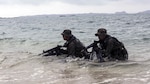 In this photo file, Japanese Ground Self-Defense Force scout swimmers emerge out of the water and sight in on their rifles during the Japanese Observer Exchange Program April 28, 2015 at Kin Blue. JOEP is a III Marine Expeditionary Force, 31st Marine Expeditionary Unit and JGSDF coordinated program designed to increase regional security, maintain unit readiness and enhance overall cooperation. This is the fourth iteration of JOEP for the 31st MEU after the initial partnership in September 2012. 