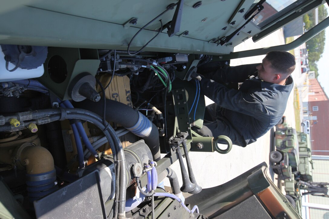Corporal Michael Shifflett checks wires on a tactical vehicle at Marine Corps Air Station Cherry Point, North Carolina, May 4, 2015. Maintenance Marines with Marine Wing Support Squadron 271 conduct preventative maintenance on tactical vehicles to ensure they are ready for use during operations and training. Shifflett is a mechanic with MWSS-271. 
