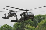 CAMP HUMPHREYS, South Korea (May, 6, 2015) - Two UH-60 Blackhawks from the 2nd Combat Aviation Brigade prepare to land at the Rodriguez Live Fire Complex in the Republic of Korea. The Blackhawks were the security for two CH-47 Chinooks while they dropped off Soldiers as part of a joint/combined training exercise that saw multiple units from across the Korean Peninsula participate.  