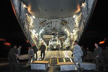 In this photo, Airmen from the 36th Contingency Response Group and U.S. Marines to prepare to unload a U.S. Marine UH-1Y Huey helicopter from a U.S. Air Force C-17 Globemaster III on May 2015 at Tribhuvan International Airport, Nepal. The 36th CRG is a rapid-deployment unit designed to establish and maintain airfield operations in a forward operating location and joined U.S. Department of State and U.S. Agency for International Development led humanitarian assistance and disaster relief operations in support of the government and armed forces of Nepal. 