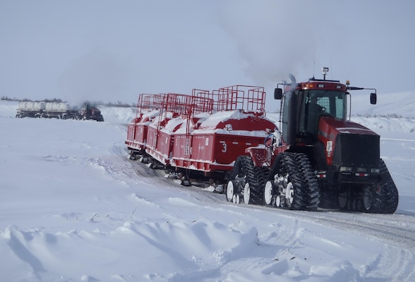 Since 2009, more than 7,800 tons of contaminated soil polluted the remote location of Test Well No. 9 near Umiat, a historic oil exploratory base camp. The conditions are harsh with the site located more than 100 miles from the nearest road system in the National Petroleum Reserve – Alaska. Several long trains of snow-tracked machinery transported the material to the disposal staging area.