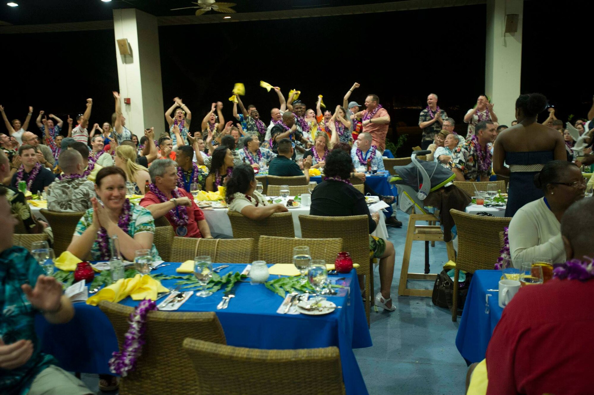 Members of the 15th Maintenance Group cheer after Master Sgt. Alfred Wells, 15th Aircraft Maintenance Squadron first sergeant, is announced as the 15th Wing First Sergeant of The Year at the 2014 Annual Awards Luau at the Historic Hickam Officers' Club on Joint Base Pearl Harbor-Hickam, Hawaii, Feb. 13, 2015. (U.S. Air Force photo by Tech. Sgt. Terri Paden)