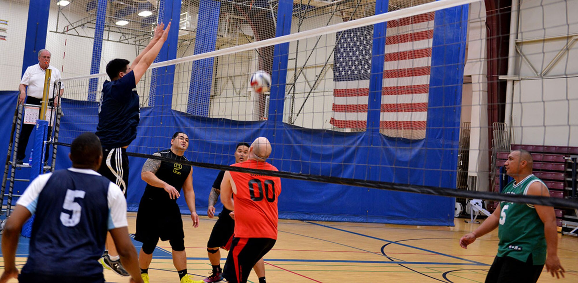 Air Force 1st Lt. Richard Kim, a contract specialist with the 673d Contracting Squadron, and Chicago, Illinois native, shuts down an attempted volley from the other team at the intramural volleyball championship game at Buckner Physical Fitness Center on Joint Base Elmendorf-Richardson, Alaska. Kim's team finished the game with an unsoiled 16-to-zero win ratio and took the championship. (U.S. Air Force photo/Airman 1st Class Kyle Johnson)