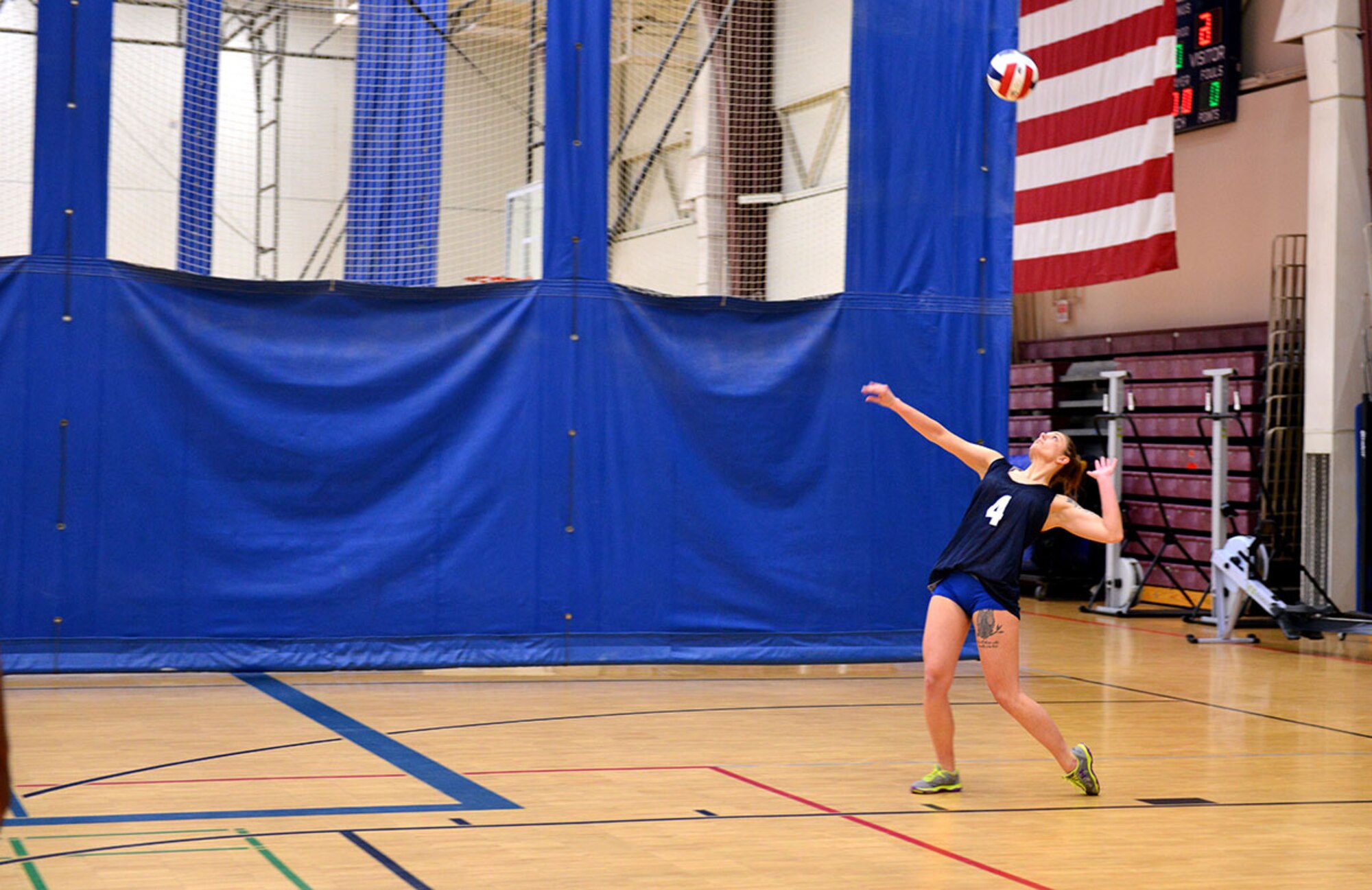 Air Force Staff Sgt. Amanda Dzierzynski, a maintenance analyst with the 732d Air Mobility Squadron, serves the ball at the JBER intramural volleyball championship game April 30 with a practiced swing. The native of Spring Valley, Illinois and her teammates finished the tournament with a 16-to-zero win-loss ratio. (U.S. Air Force photo/Airman 1st Class Kyle Johnson)