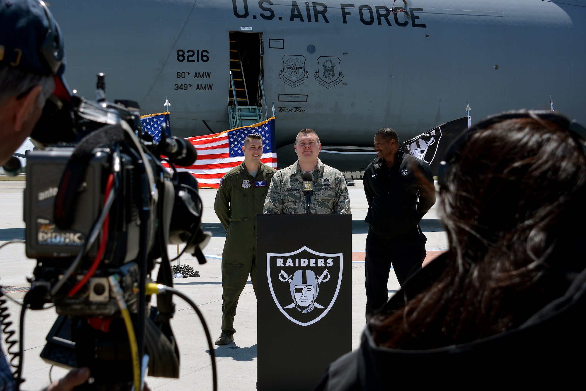 Tech. Sgt. Patrick Harrower, 60th Air Mobility Wing public affairs, prepares to announce a player selection for the Oakland Raiders May 2, 2015, during Day 3 of the NFL Draft, at Travis Air Force Base, California. (U.S Air Force photo by Senior Airman Charles Rivezzo)