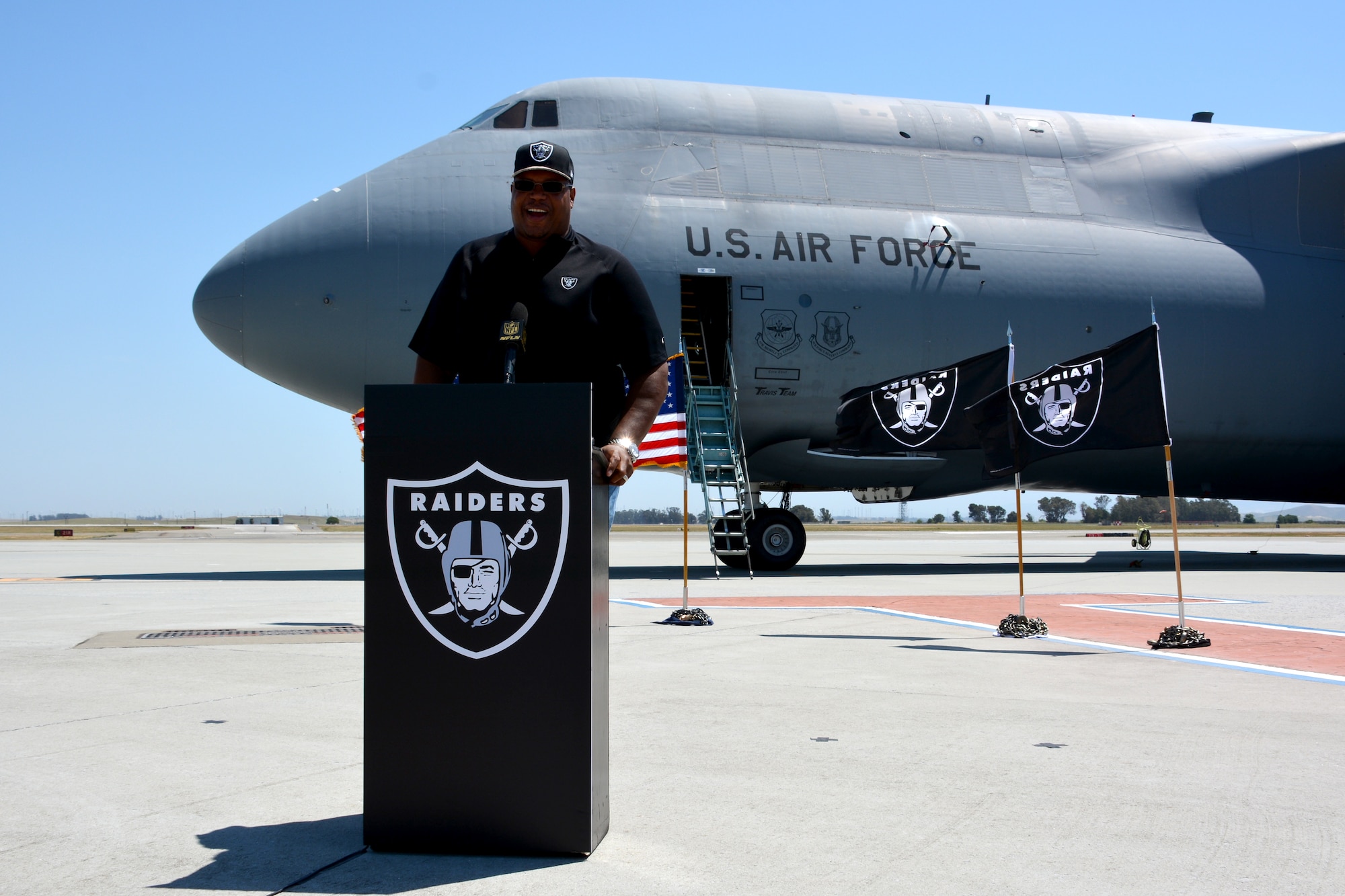 Lincoln Kennedy, Oakland Raider alumni, poses for a photo on flightline May 2, 2015, during Day 3 of the NFL Draft, at Travis Air Force Base, California. (U.S Air Force photo by Senior Airman Charles Rivezzo)