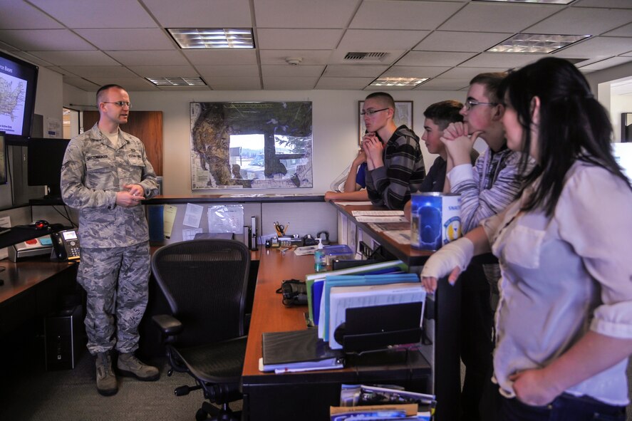 Senior Airman Howard Spitzenberger, 92nd Operations Support Squadron weather forecaster, shows students from Medical Lake High School Junior ROTC the weather tracking system used by the Air Force May 4, 2015, at Fairchild Air Force Base, Wash. Community engagement activities like these showcase Air Force capabilities to the public increasing trust, support and in the case of these Air Force JROTC cadets, interest in joining the Air Force. (U.S. Air Force photo/Airman 1st Class Taylor Bourgeous)