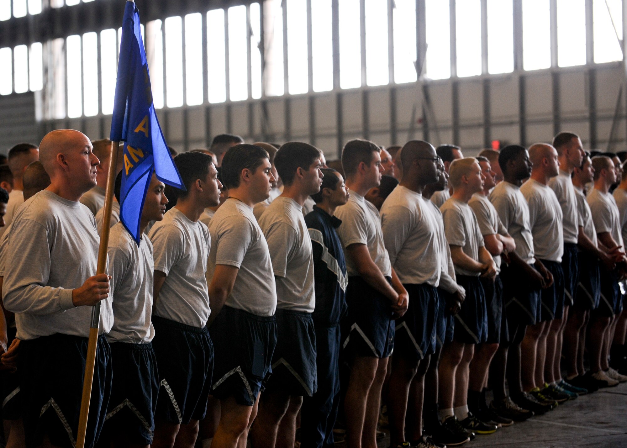 Ellsworth Airmen listen to Col. Kevin Kennedy, 28th Bomb Wing commander, speak during a commanders call inside the Pride Hangar at Ellsworth Air Force Base, S.D., April 23, 2015.  The commander’s call focused on building the social pillar of Airman fitness and the importance of sexual assault prevention and response training. (U.S. Air Force photo by Senior Airman Anania Tekurio/Released)