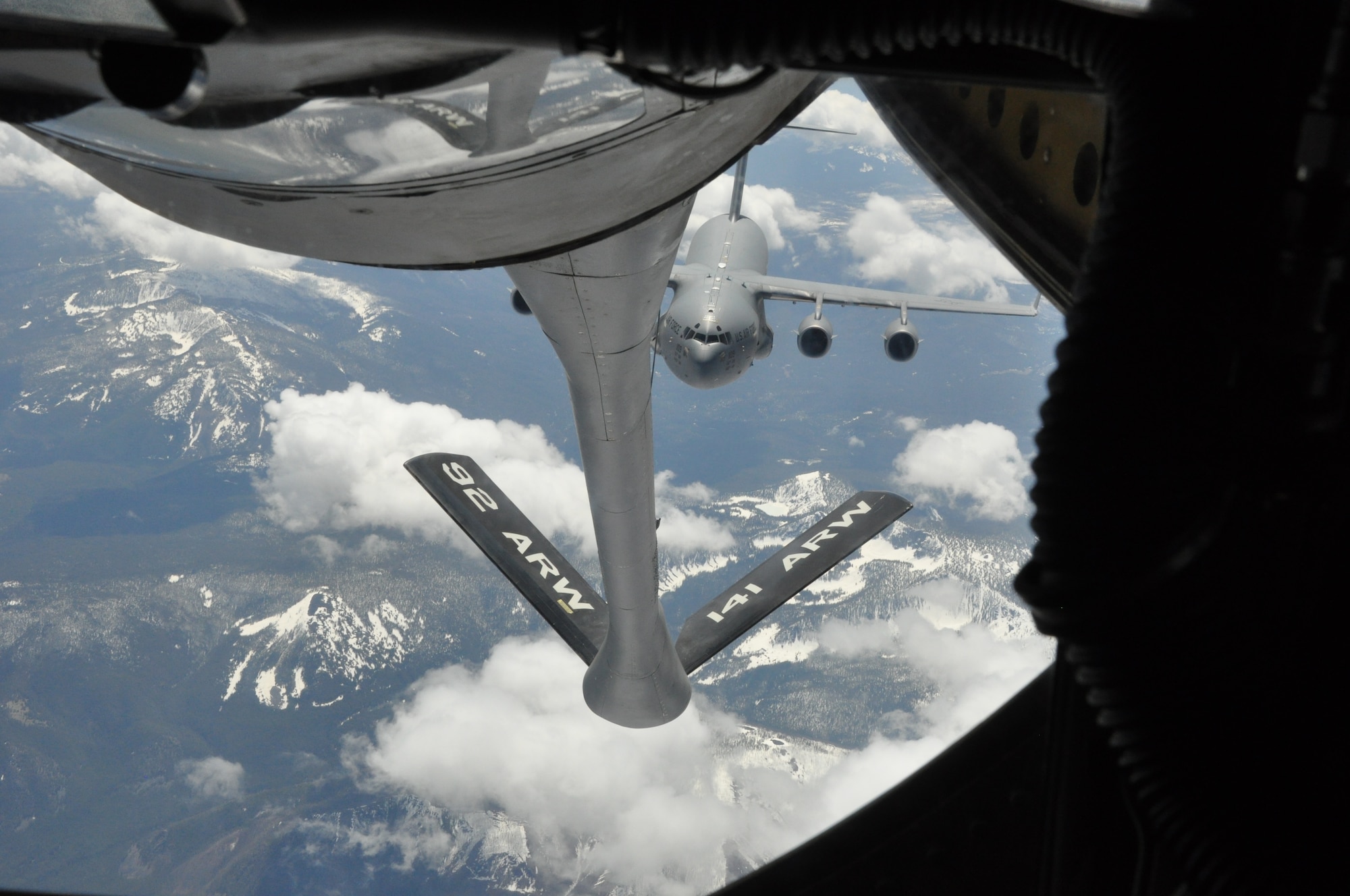 A KC-135 Stratotanker, assigned to 93rd Air Refueling Squadron at Fairchild Air Force Base, Wash., refuels a C-17 Globemaster III May 5, 2015, over Western Montana. The KC-135 can hold up to 200,000 pounds of fuel, nearly all of which can be pumped through the flying boom, the KC-135's primary fuel transfer method. (U.S. Air Force photo/Capt. Kedem Alon)