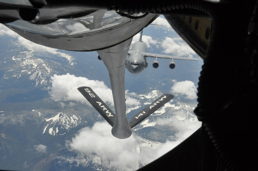 A KC-135 Stratotanker, assigned to 93rd Air Refueling Squadron at Fairchild Air Force Base, Wash., refuels a C-17 Globemaster III May 5, 2015, over Western Montana. The KC-135 can hold up to 200,000 pounds of fuel, nearly all of which can be pumped through the flying boom, the KC-135's primary fuel transfer method. (U.S. Air Force photo/Capt. Kedem Alon)