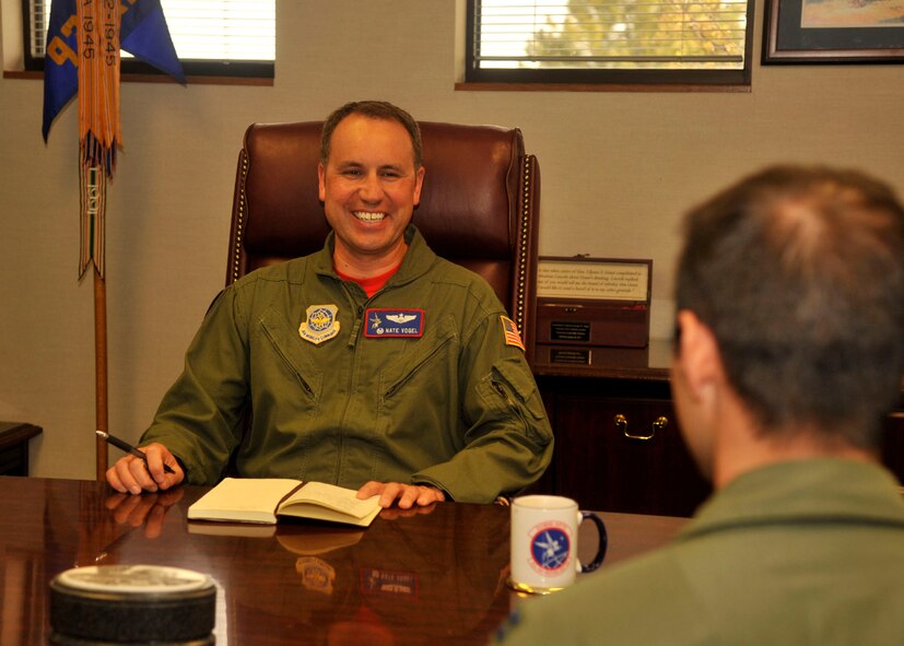 Lt. Col. Nate Vogel, 93rd Air Refueling Squadron commander, speaks with an Airman April 10, 2015, at Fairchild Air Force Base, Wash. Vogel took over as squadron commander in 2014, with 120 personnel assigned to the squadron and 35 KC-135 Stratotankers assigned to the base. The squadron recently celebrated its 66th birthday and 20 years at Fairchild AFB. (U.S. Air Force photo/Airman 1st Class Taylor Bourgeous)