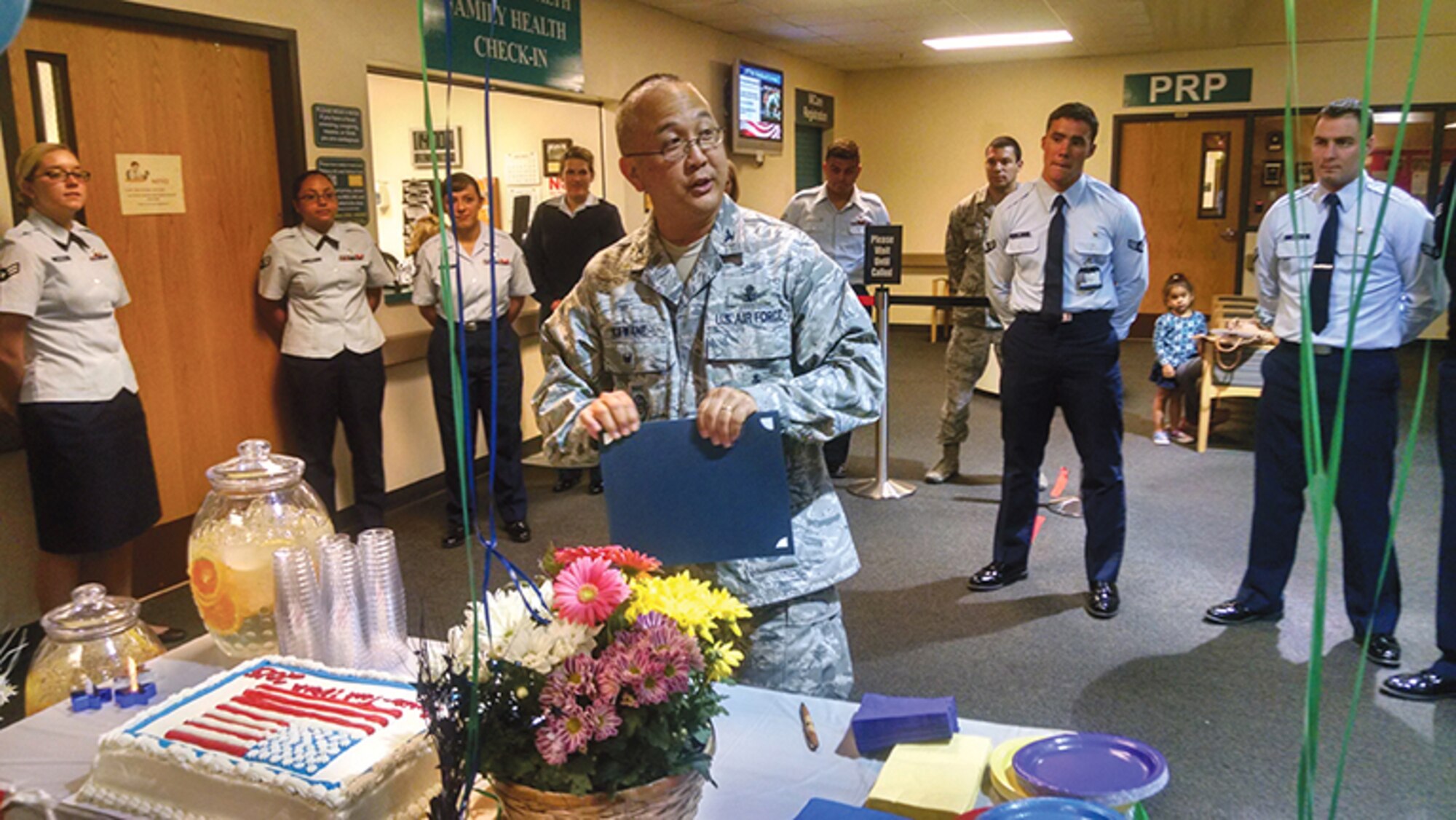 Col. Lance Kawane, 377th Air Base Wing vice commander, speaks to the staff of the 377th Medical Group after signing a proclamation honoring the group’s nurses and medical technicians. (Photo by Ryan Stark)