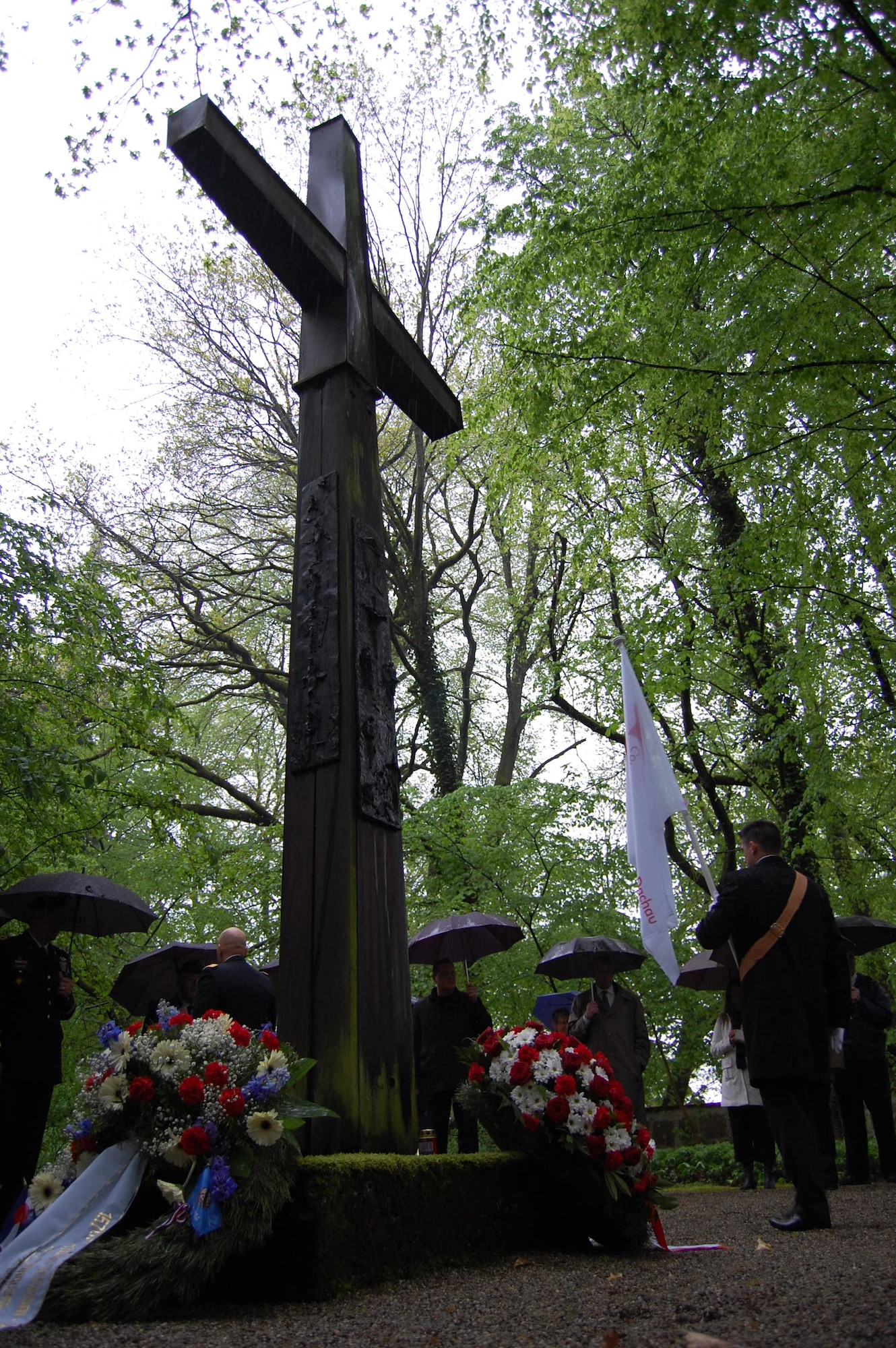 Members of the Colorado and Oklahoma National Guards honor those who died in Dachau Concentration Camp during World War II by laying a wreath at the Leitenberg Cemetery in Dachau, Germany, where over 7,400 prisoners were buried. Members of the Colorado and Oklahoma National Guard participated in various ceremonies May 1-3, 2015, commemorating the 70th anniversary of the liberation of the concentration camp, Dachau. The 157th Infantry Regiment, one of the units that liberated the camp on April 29, 1945, initially mustered from the state of Colorado. The regiment was a subordinate unit to the 45th Infantry Division, initially formed in Oklahoma. (Air National Guard photo by Capt. Kinder Blacke)
