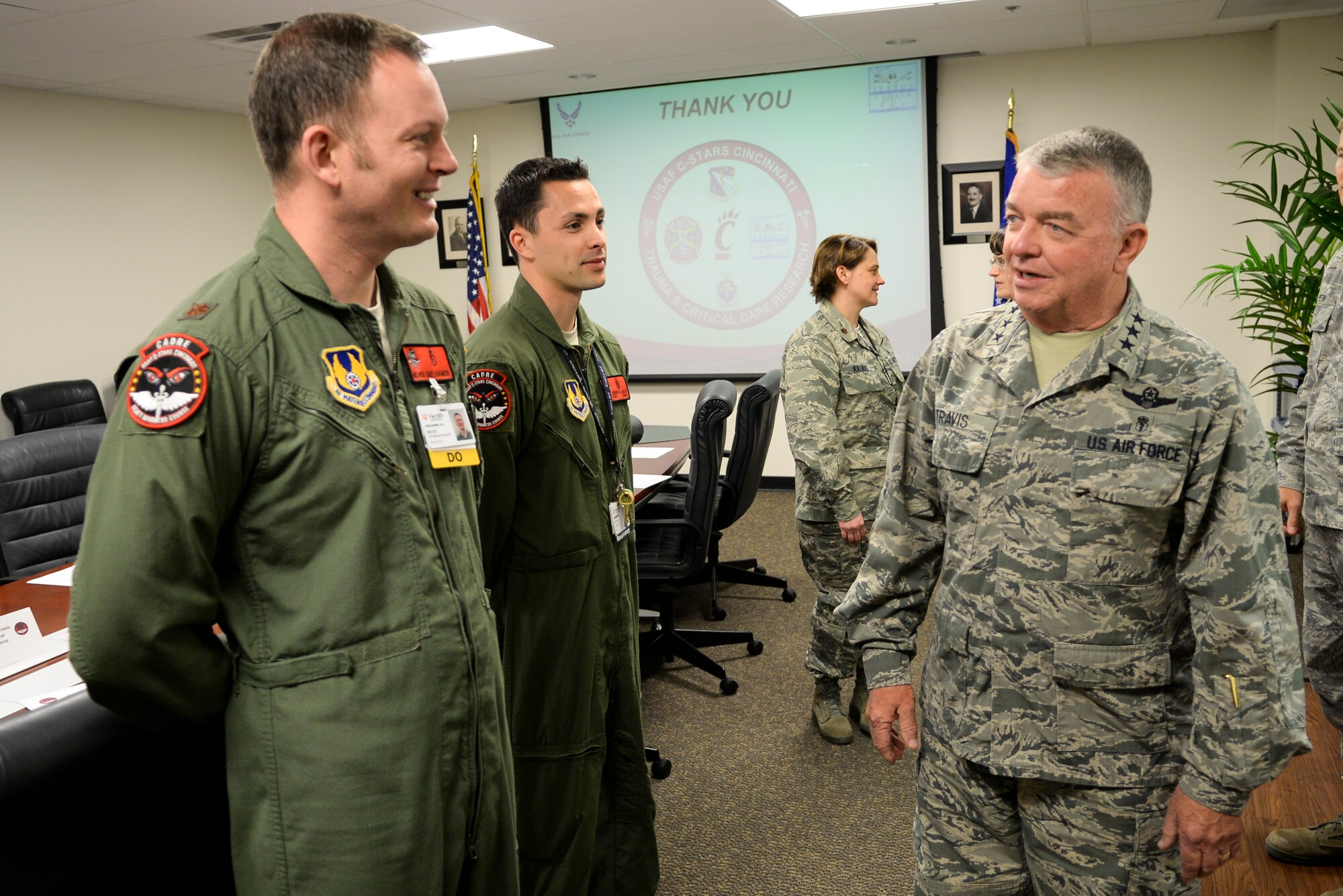Air Force Surgeon General Lt. Gen. (Dr.) Thomas Travis, talks with Center for Sustainment of Trauma and Readiness Skills instructors,  Maj. Mehdi Shelhamer, pulmonologist, and TSgt. Jensen De Nijs, respiratory therapist, during his visit to CSTARS at the University of Cincinnati Health in Cincinnati, Ohio, April 30.  The third of its kind in the nation, CSTARS is joint program between University of Cincinnati Medical Center and the Air Force which provides critical trauma and critical care air transport team training to deploying medics, and is a training platform to ensure personnel remain ready and current.  The Cincinnati program has 12 high-definition medical patient simulators used for research and training new doctors and nurses. (U.S. Air Force photo by Wesley Farnsworth / Released)