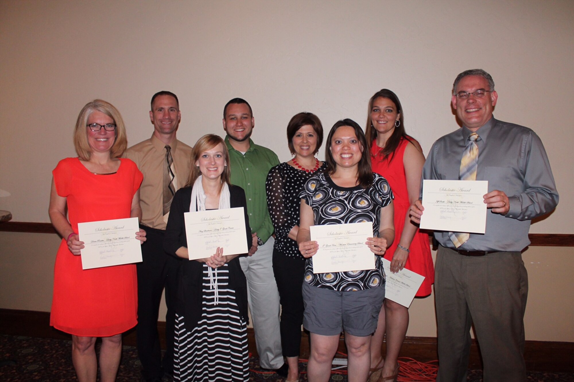Scholarship recipients pose for a photo after a scholarship dinner at the Larkspur Bar and Bistro in Wichita, Kan., May 1, 2015. The McConnell Officers’ Spouses’ Charity Association distributed more than $25,000 worth of scholarships to 18 military and federal employee’s dependents to provide the opportunity to seek secondary education. (Courtesy photo)