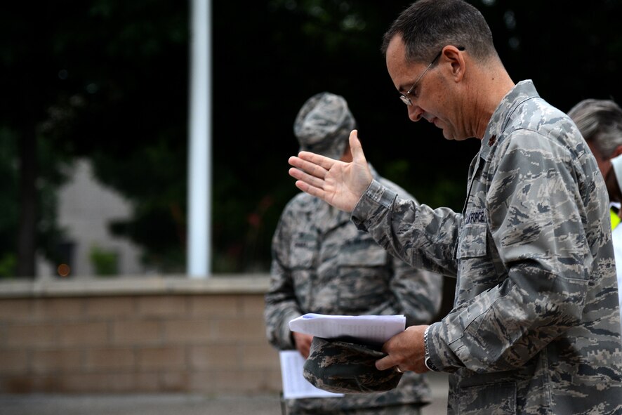 Chaplain (Maj.) Richard Beyea, 47th Flying Training Wing chaplain, delivers a prayer at Heritage Park on Laughlin Air Force Base, Texas, May 7, 2015. On May 8, 1988, former President Ronald Reagan passed a law, designating the first Thursday in May as the annual observance for the National Day of Prayer. (U.S. Air Force photo by Airman 1st Class Ariel D. Partlow)