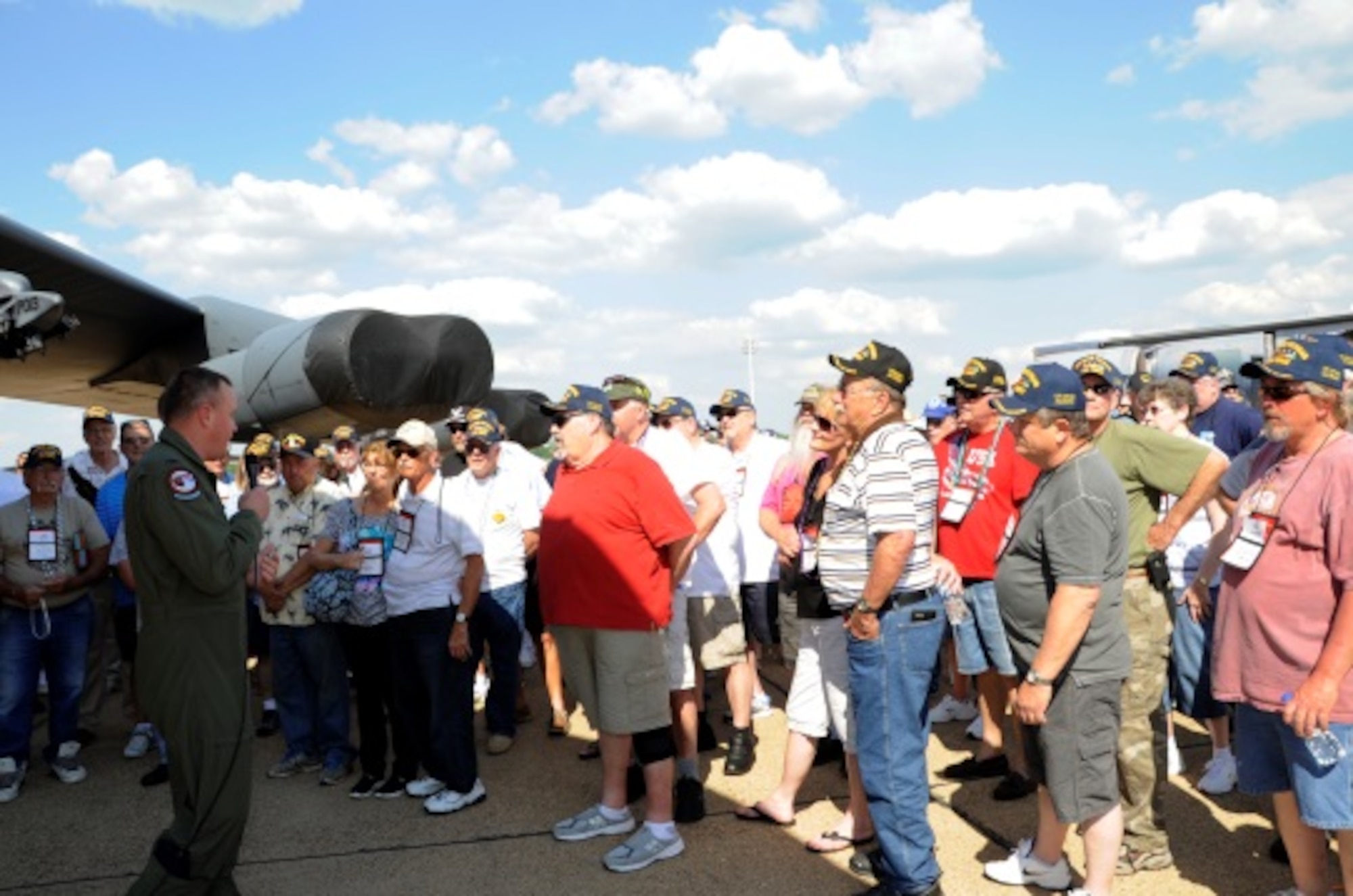 U.S. Air Force Colonel Bruce Cox, commander of the 307th Bomb Wing at Barksdale Air Force Base, La, explains the new nose art on a B-52 Stratafortress to a group of Vietnam Veterans who were attending a reunion during at the Defenders of Liberty Air Show on May 1, 2015. The Lone Star Lady II was dedicated to the men and women who served during the Vietnam War. (U.S. Air Force photo by Master Sgt. Laura Siebert/Released)