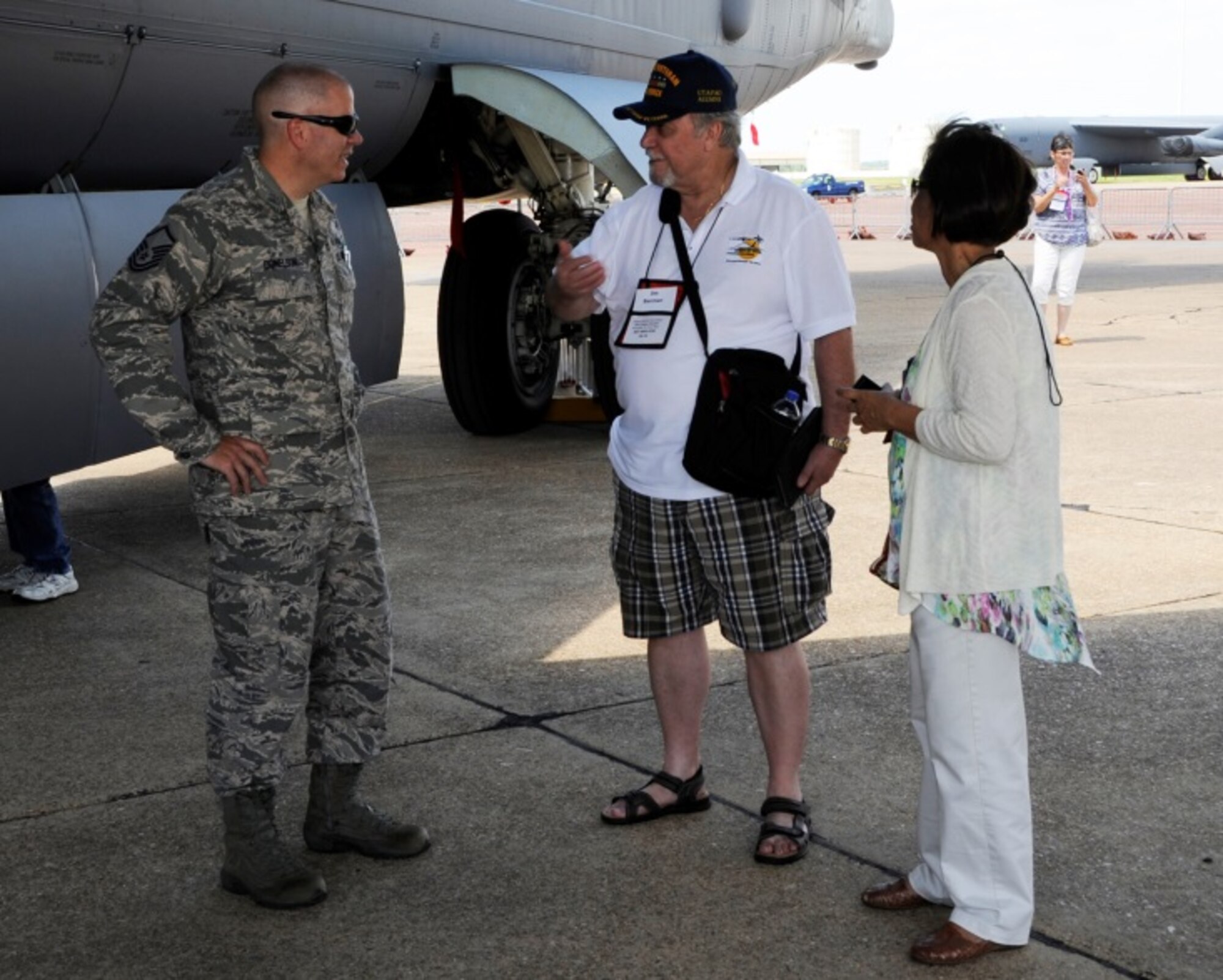 U. S. Air Force Master Sgt. John Donelson, 307th Maintenance Squadron, Barksdale Air Force Base, La., talks to a Vietnam Veteran at the unveiling of the Lone Star Lady II, on a B-52 Stratofortress.  The original Lone Star Lady nose art was on a Vietnam Era B-52 that flew over Vietnam during Strategic Air Command’s Operation Linebacker II.  (U.S. Air Force photo by Master Sgt. Laura Siebert/Released) 