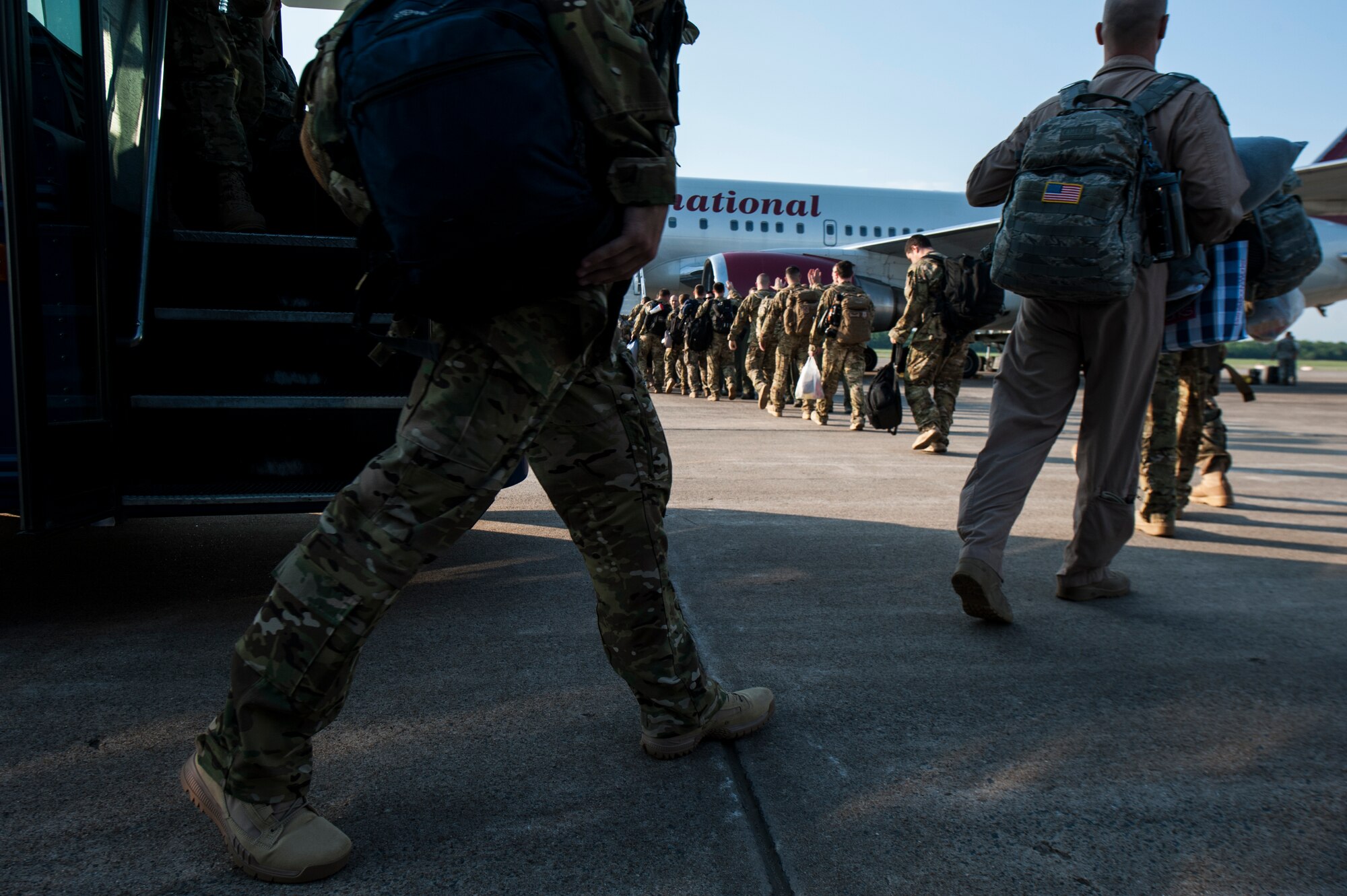 Airmen board an aircraft for deployment May 4, 2015, at Little Rock Air Force Base Ark. Base leadership lined the way to the plane giving their best wishes and support. (U.S. Air Force photo by Senior Airman Kaylee Clark) 