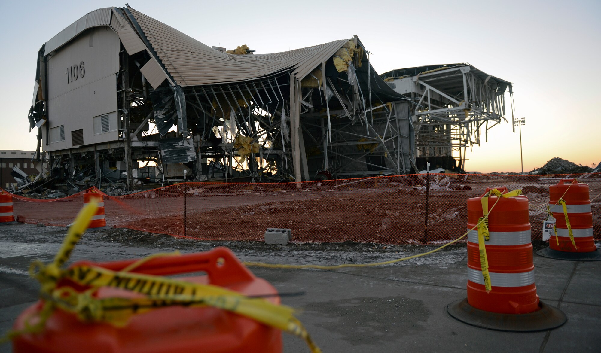 Hangar 1106 sits in pieces on the flightline, Jan. 8, 2015, at McConnell Air Force Base, Kan. The 22nd Maintenance Squadron shops that used to occupy the space were moved to temporary facilities as construction continues on new hangars. Although the 22nd MXS has lost space the maintenance mission continues uninterrupted. (U.S. Air Force photo by Senior Airman Colby Hardin)