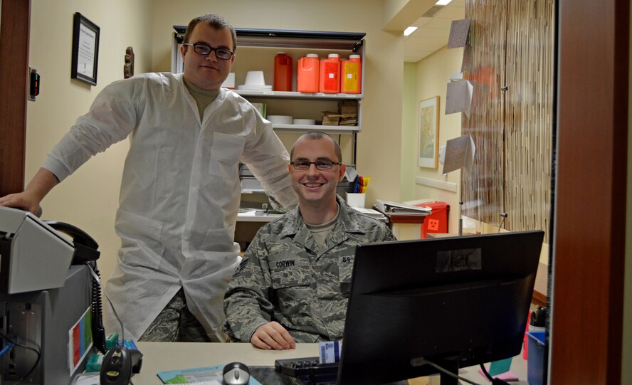 Senior Airmen Randy Corwin and Dakota Nicolson, laboratory technicians from the 477th Aerospace Medicine Flight, prepare patient tests for shipment during preventative health assessments May 2. PHAs ensure members of the 477th Fighter Group are medically ready and qualified to complete the mission.