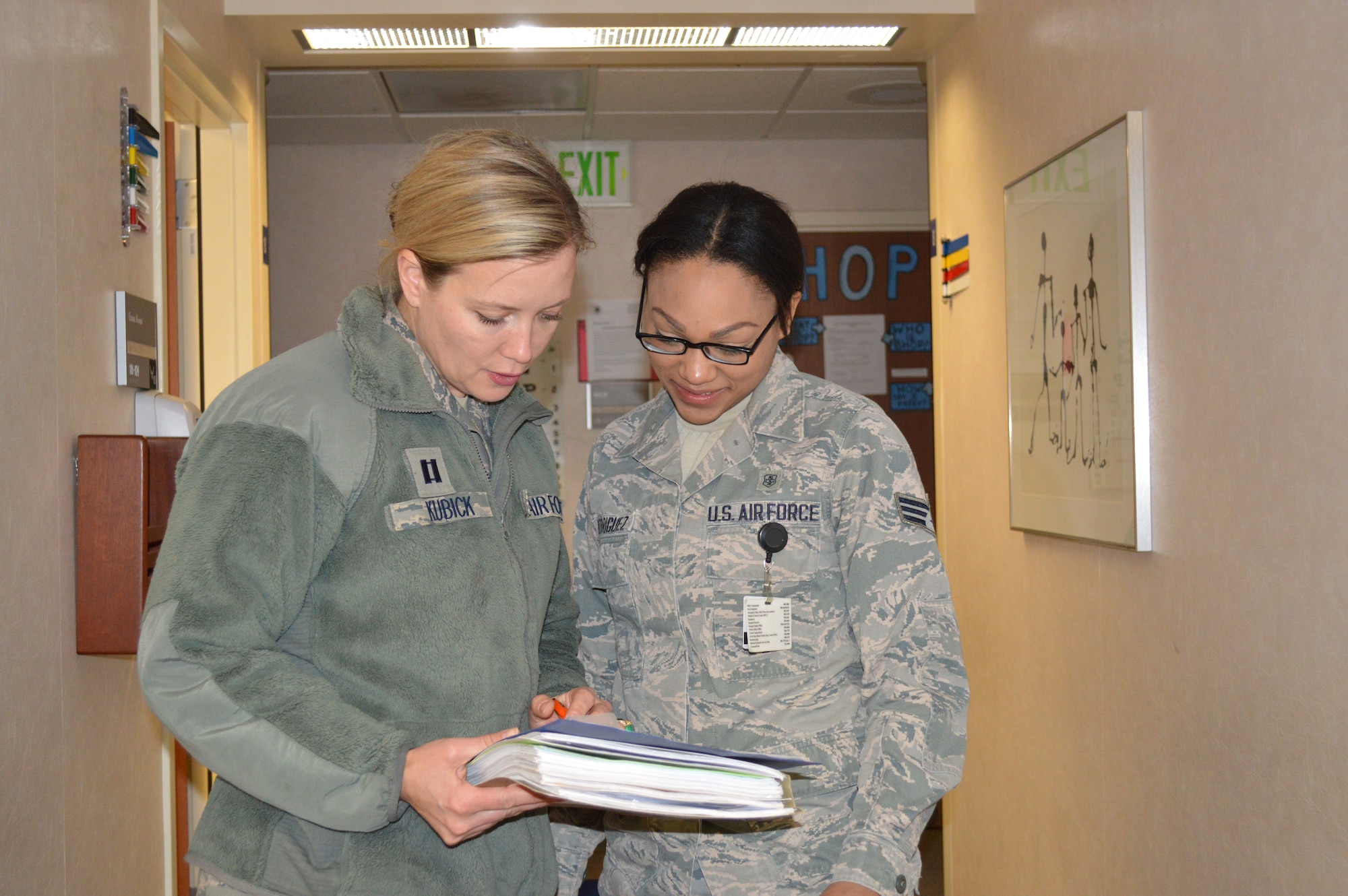 Capt. Kimberly Kubick and Senior Airman Angela Rodriguez review records during preventative health assessments May 2. PHAs keep members of the 477th Fighter Group qualified and ready to complete the mission world-wide.