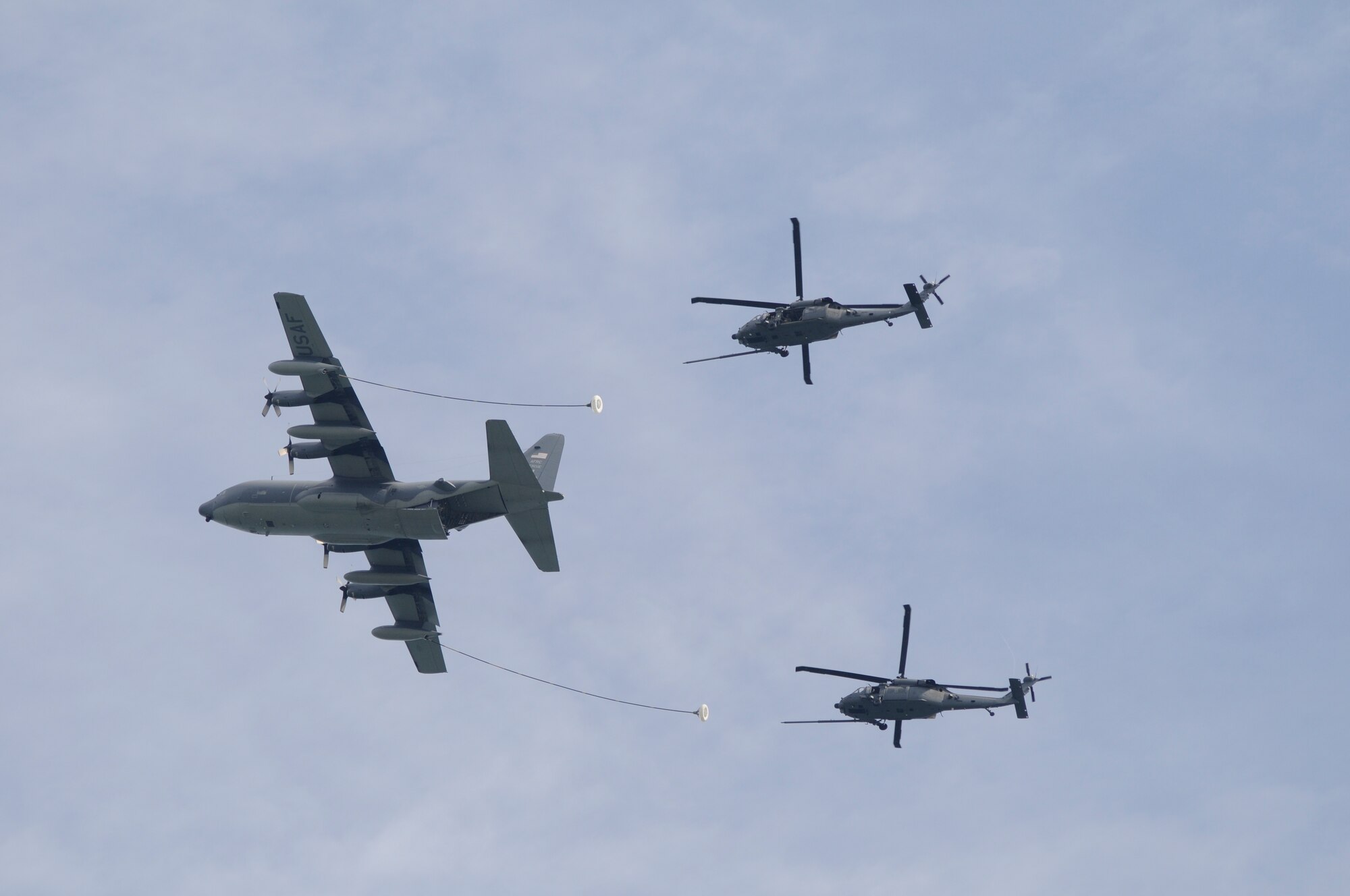 Air Force Reservists from the 920th Rescue Wing, Patrick Air Force Base, Florida, received an overall "Effective" rating April 24 - 26, 2015 by a 40-member AFRC Inspector General team under a brand new inspection process. Called Capstone, it is now a Commander's Inspection Program (CCIP) and it's led internally by a Wing Inspection Team (WIT). Shown here a crew of 920th Airmen refuel two Wing HH-60G Pave Hawk helicopters with their HC-130P/N King Air Refueler. (USAF photo)
