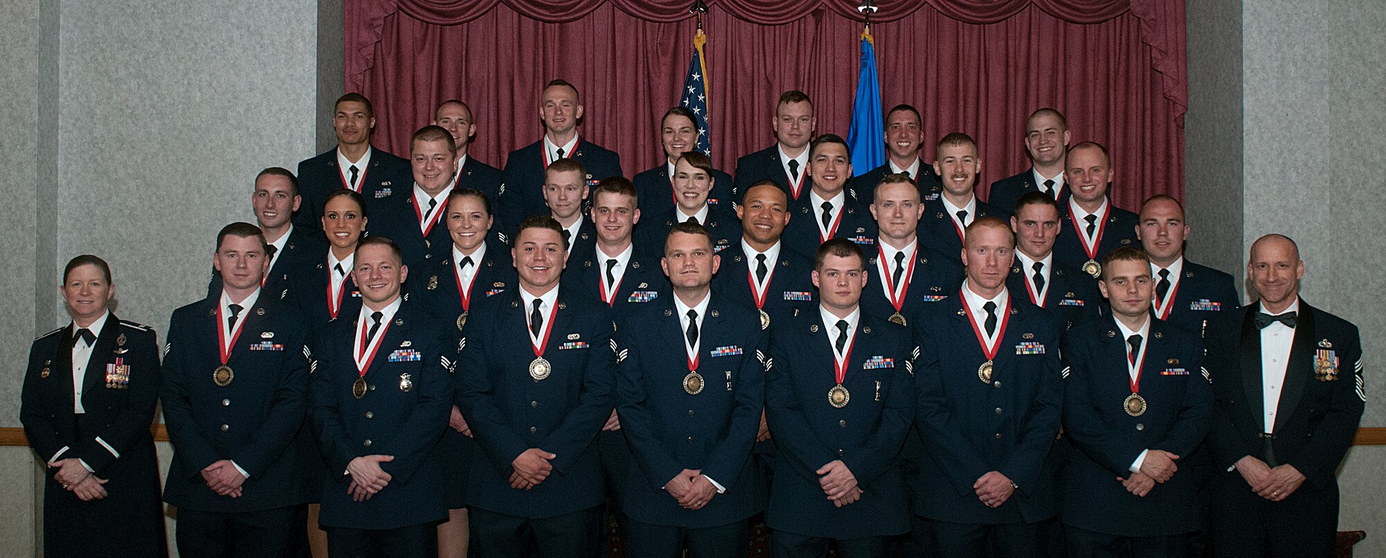 Col. Tracey Hayes, 90th Missile Wing commander, and Chief Master Sgt. Samuel Couch, 90th MW command chief, pose for a photo with Airmen Leadership School class 15-E May 6, 2015, on F.E. Warren Air Force Base, Wyo. ALS is a six-week course designed to prepare Airmen to assume supervisory duties as well as instruction in the practice of leadership and followership. Enlisted Airmen must graduate ALS before supervising other Airmen. (U.S. Air Force photo by Airman 1st Class Brandon Valle)