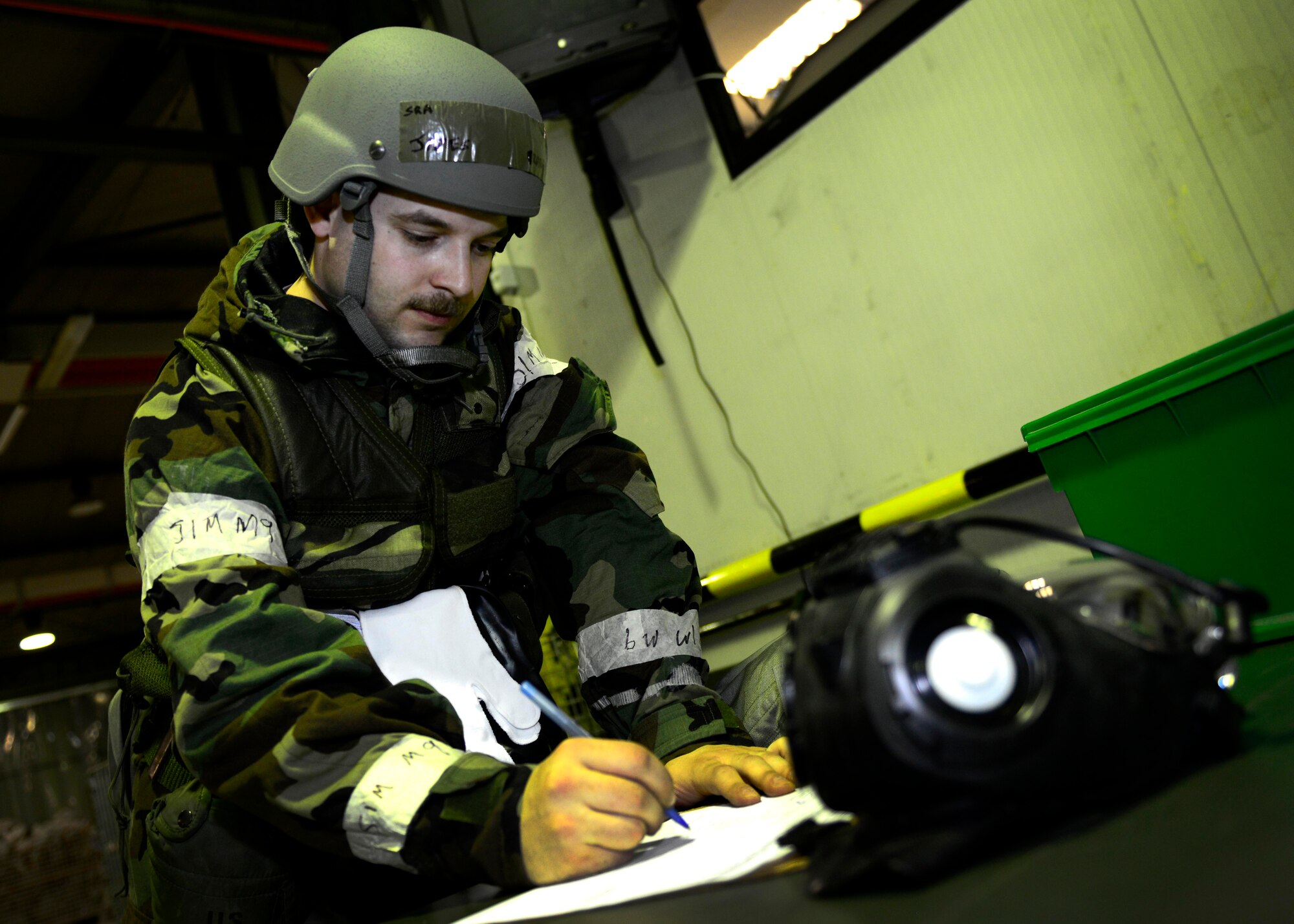 U.S. Air Force Senior Airman James Bradshaw, 31st Logistic Readiness Squadron individual protective equipment journeyman, exchanges an individual’s gas mask, during inspection MAROON EXCAVATOR, April 6, 2015, at Aviano Air Base, Italy. During the inspection, several personnel were required to exchange their masks for newer ones. (U.S. Air Force Senior Airman Areca T. Wilson/Released)