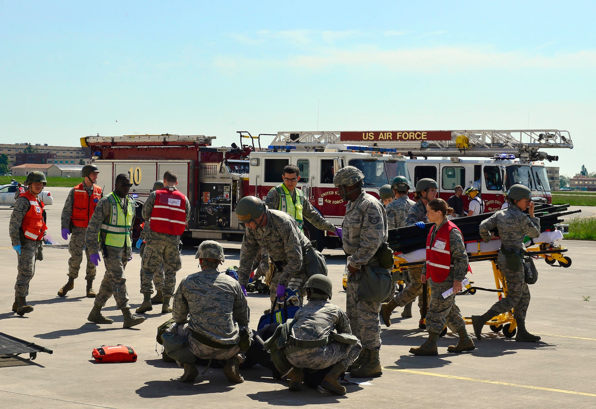 U.S. Air Force emergency responders assist injured personnel after a simulated earthquake, during inspection MAROON EXCAVATOR, May 6, 2015, at Aviano Air Base, Italy.  The inspection scenario tested the coordination of several squadrons in response to an emergency.  (U.S. Air Force photo by Airman 1st Class Cary Smith/Released)