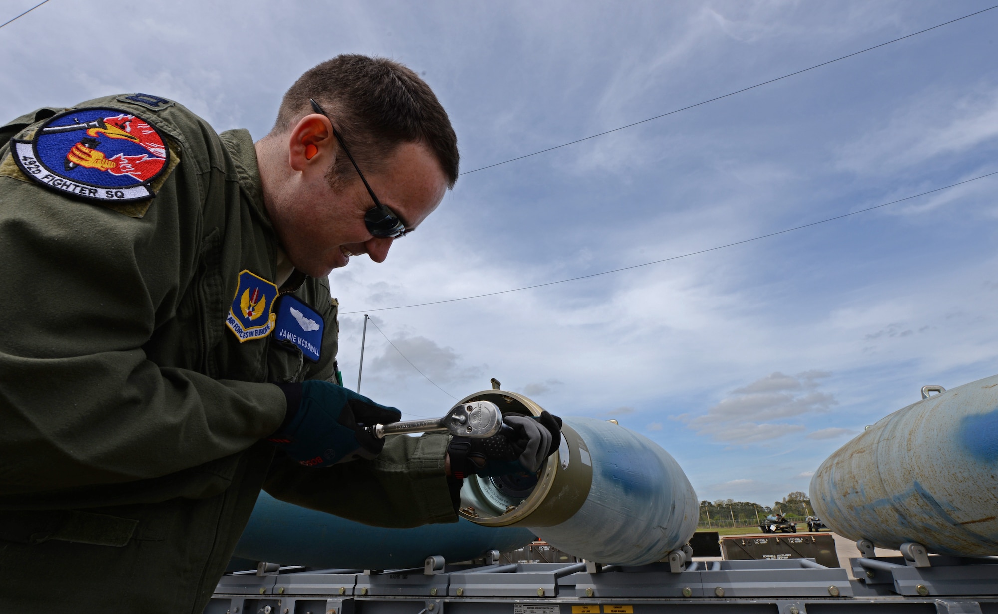 Capt. Jamie McDowall, 492nd Fighter Squadron F-15E Strike Eagle pilot, fits the forward adapter onto a Guided Bomb Unit-24 at Royal Air Force Lakenheath, England, May 4, 2015. The bomb-build immersion event gave aircrew participants a cradle-to-grave understanding of the weapons they utilize, while promoting synergy between the operations and maintenance groups. (U.S. Air Force photo by Airman 1st Class Erin R. Babis/Released)