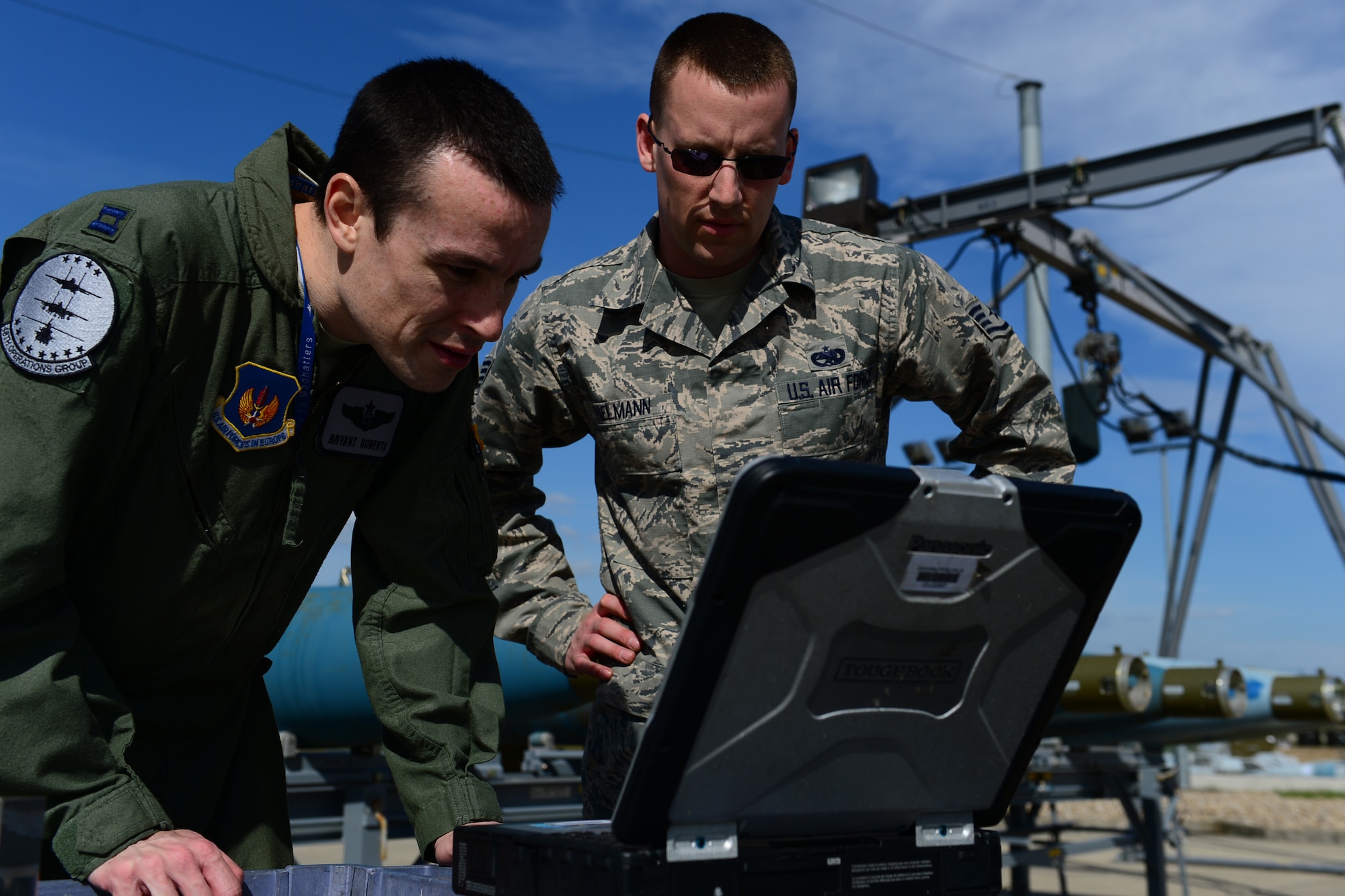 Staff Sgt. Shane Thielmann, 48th Munitions Squadron conventional maintenance crew chief, reviews technical data with Capt. Bryant Roberts, 492nd Fighter Squadron F-15E Strike Eagle weapon system officer during a Guided Bomb Unit-24 operation at Royal Air Force Lakenheath, England, May 4, 2015. The bomb-build immersion event gave aircrew participants a cradle-to-grave understanding of the weapons they utilize, while promoting synergy between the operations and maintenance groups. (U.S. Air Force photo by Airman 1st Class Erin R. Babis/Released)