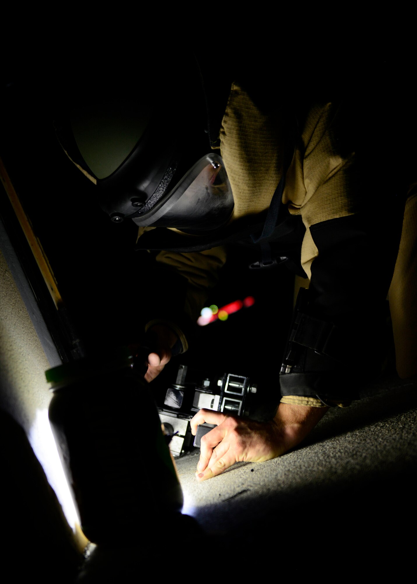U.S. Air Force Staff Sgt. Michael Ault, 31st Civil Engineer Squadron explosive ordnance disposal technician, neutralizes a simulated suspicious package, during inspection MAROON EXCAVATOR, May 5, 2015, at Aviano Air Base, Italy. During the inspection, EOD Airmen responded to a simulated suspicious package which tested their readiness procedures. (U.S. Air Force Senior Airman Areca T. Wilson/Released)