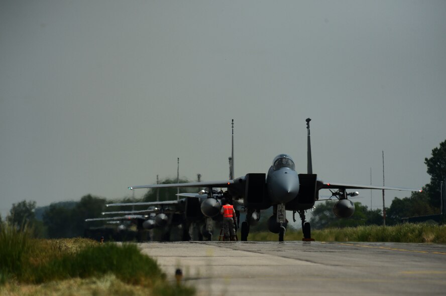 A group of F-15 Eagle fighter aircraft from the Florida Air National Guard's 125th Fighter Wing land at Graf Ignatievo Air Base, Bulgaria, May 7, 2015. The 159th Expeditionary Fighter Squadron is part of Europe's first-ever Theater Security Package and will conduct partnered training with the Bulgarian Air Force to bolster interoperability and enhance European safety and security. (U.S. Air Force photo by Senior Airman Gustavo Castillo/Released)