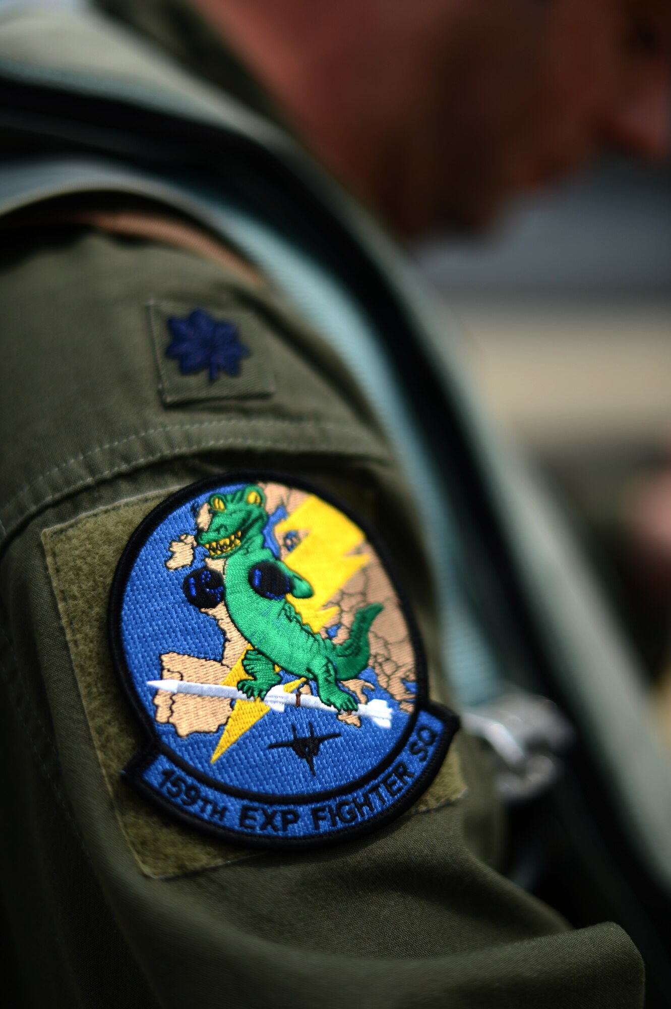 A patch rests on the shoulder of U.S. Air Force Lt. Col. Jerry Reedy, 159th Expeditionary Fighter Squadron commander, on the flightline at Graf Ignatievo Air Base, Bulgaria, May 7, 2015. The Airmen are from the Florida Air National Guard's 125th Fighter Wing and their contributions enable the Air Force to bolster regional security while enhancing interoperability with NATO partners. (U.S. Air Force photo by Senior Airman Gustavo Castillo/Released)