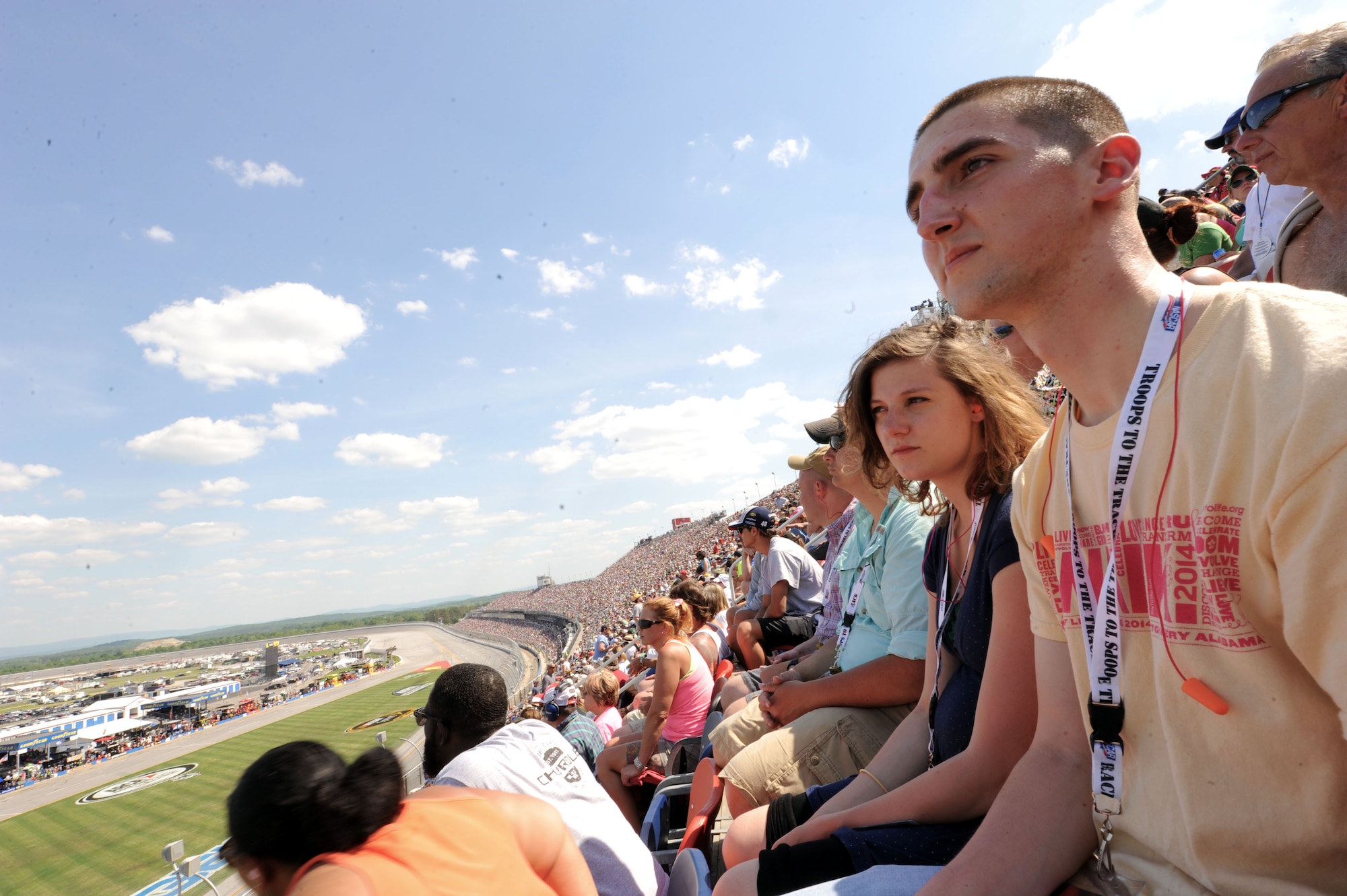 Senior Airman Vincent Glenn-Stone, Air Force Lifecycle Management Center cyber services technician, watches the Geico 500 race at the Talladega Superspeedway, May 3, 2015, Talladega, Alabama. Being a recipient of Air Education and Training Command’s 2015 12 Outstanding Airmen of the Year award, Glenn-Stone was selected to attend the race as part of NASCAR’s Troops to the Track program. (U.S. Air Force photo by Airman 1st Class Alexa Culbert/Cleared) 