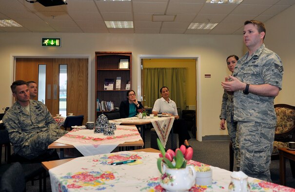 U.S. Air Force Staff Sgt. Noah Lubben, right, Detachment 225 Intelligence Squadron Airborne Cryptologic Language analyst from Provo, Utah, and U.S. Air Force Senior Airman Jessica Gutierrez, second from right, 21st Operational Weather Squadron weather forecaster from Clio, Mich., share their individual experiences with sexual assault to Team Mildenhall members during a Sexual Assault Prevention and Response Tea and Talk, April 30, 2015, on RAF Mildenhall, England. Lubben and Gutierrez shared their story with leadership and Airmen across multiple bases hoping to encourage people to step-up and step-in. (U.S. Air Force photo by Airman 1st Class Kyla Gifford/Released)