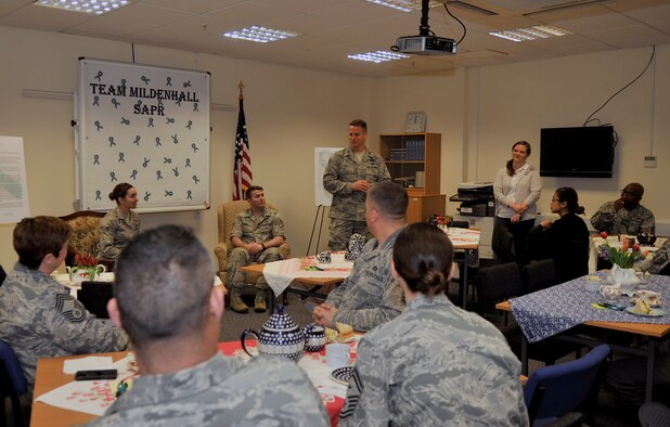 U.S. Air Force Col. David Cox, 100th Air Refueling Squadron vice commander, speaks to Team Mildenhall members during a Sexual Assault Prevention and Response Tea and Talk, April 30, 2015, on RAF Mildenhall, England. This event, hosted by the SAPR office, offered tea and snacks providing a relaxed atmosphere for two survivors who told their stories of courage and strength. (U.S. Air Force photo by Airman 1st Class Kyla Gifford/Released)