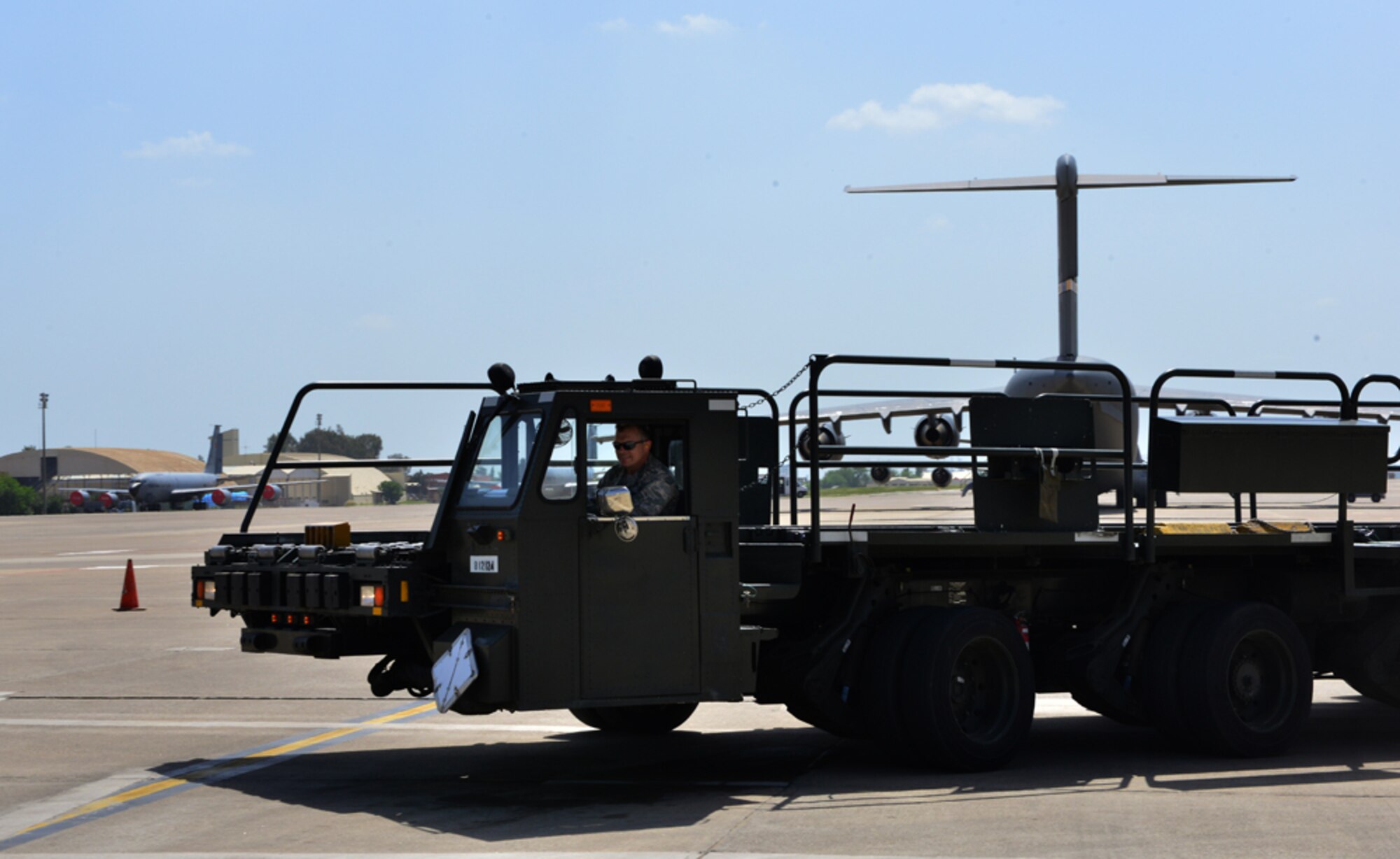 Col. Craig Wills, 39th Air Base Wing commander, drives a Tunner 60K Aircraft Cargo Loader during a unit visit as part of the commander’s Out Connecting with Airmen Program April 30, 2015, at Incirlik Air Base, Turkey. While visiting the 728th Air Mobility Squadron, Wills completed a Tunner 60K Aircraft Cargo Loader confidence course that all drivers must pass before using the vehicle. (U.S. Air Force photo by Senior Airman Michael Battles/Released) 

