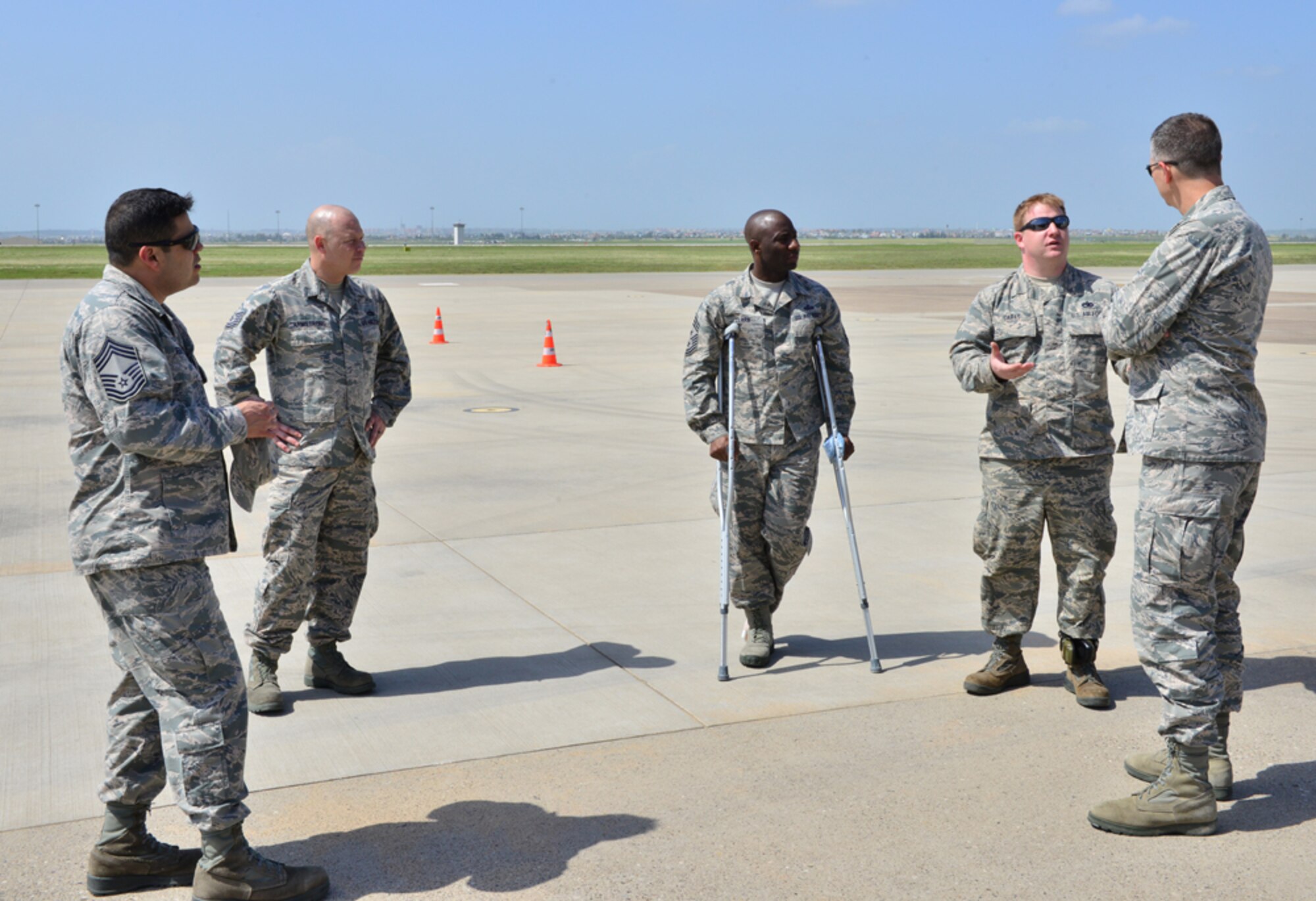 Col. Craig Wills, 39th Air Base Wing commander, and Chief Master Sgt. Vegas Clark, 39th ABW command chief, speak with members from the 728th Air Mobility Squadron during a unit visit as part of the commander’s Out Connecting with Airmen Program April 30, 2015, at Incirlik Air Base, Turkey. During their visit, Wills and Vegas learned the proper way to drive a Tunner 60K Aircraft Cargo Loader and learned the process of transitioning through the passenger terminal when arriving and departing Incirlik.  (U.S. Air Force photo by Senior Airman Michael Battles/Released)