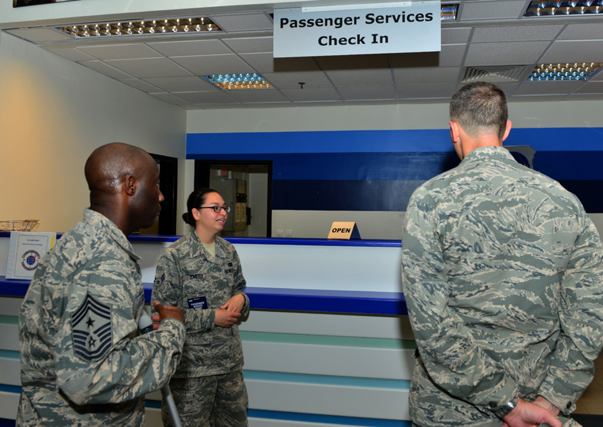 Airman 1st Class Caitlin Emery, 728th Air Mobility Squadron passenger service agent, briefs Col. Craig Wills, 39th Air Base Wing commander and Chief Master Sgt. Vegas Clark, 39th ABW command chief, during a unit visit which is part of the commander’s Out Connecting with Airmen Program April 30, 2015, at Incirlik Air Base, Turkey. During his visit, Wills learned the difference services available to passengers at Incirlik’s terminal when arriving and departing the installation. (U.S. Air Force photo by Senior Airman Michael Battles/Released) 