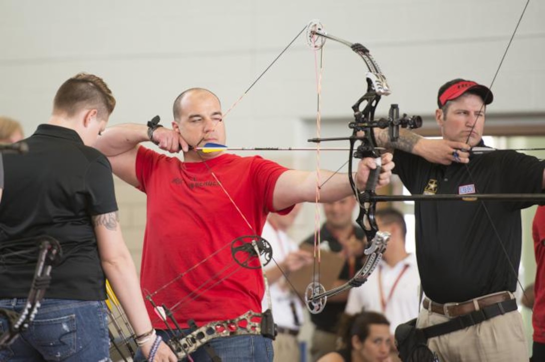 U.S. Army Capt. Joe Colón, Jr., Warrior Transition Unit Soldier, aims his bow during trials for the Warrior Games Army Team at Fort Bliss, Texas, March 31, 2015. Colón broke his ankle in 2014, sending him to the WTU where he found a new passion for adaptive sports. (Courtesy Photo)