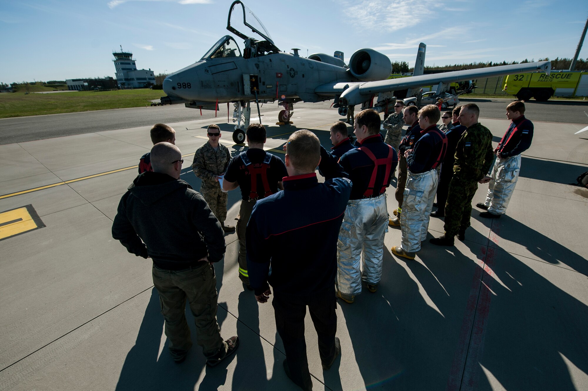 A firefighter from the 52nd Civil Engineer Squadron deployed with the 354th Expeditionary Fighter Squadron briefs Estonian air force firefighters during a theater security package deployment May 4, 2015, at Ämari Air Base, Estonia. These TSP deployments would not be as possible without the strategic access provided by the infrastructure, support and Host Nation relationships at current European U.S. installations. (U.S. Air Force photo by Senior Airman Rusty Frank/Released)