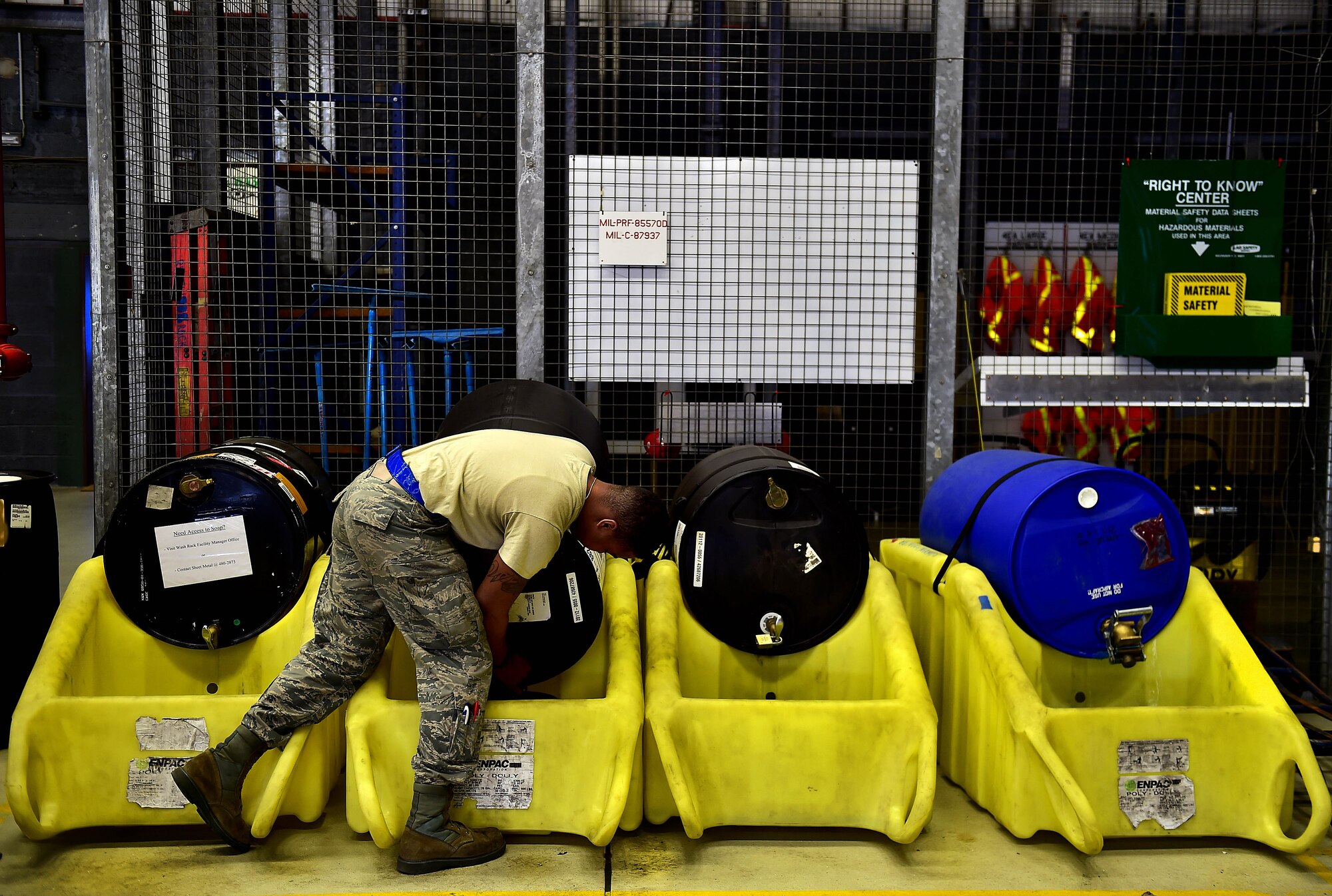 An Airman from the 86th Aircraft Maintenance Squadron fills a bucket with soap before washing a C-130J Super Hercules April 20, 2015, at Ramstein Air Base, Germany. Aircraft washing is a vital part of the flying mission, and if not washed regularly, aircraft begin to corrode and cause damage yielding it unsafe to operate. (U.S. Air Force photo/Staff Sgt. Sara Keller)